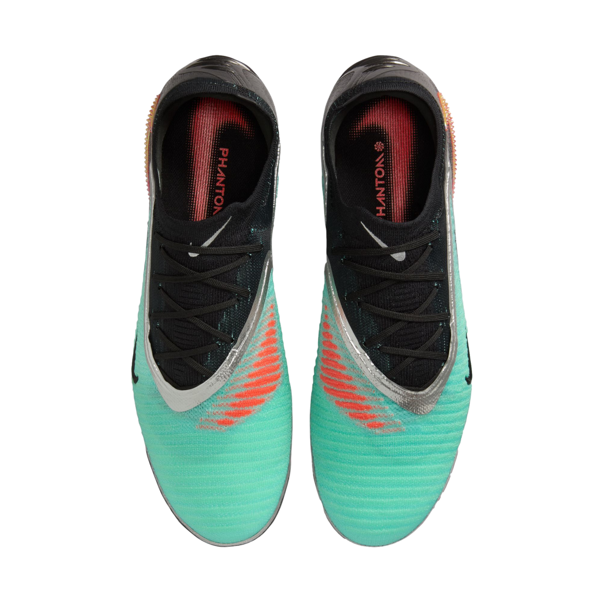 Top-down view of a pair of Nike Phantom soccer boots in turquoise and black with silver accents and orange striped details.