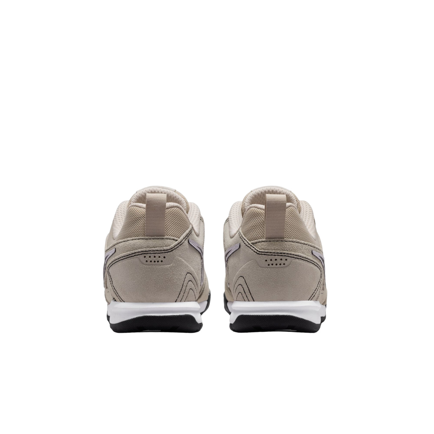 A rear view of a pair of beige sneakers with white midsoles and black outsoles, set against a solid black background.