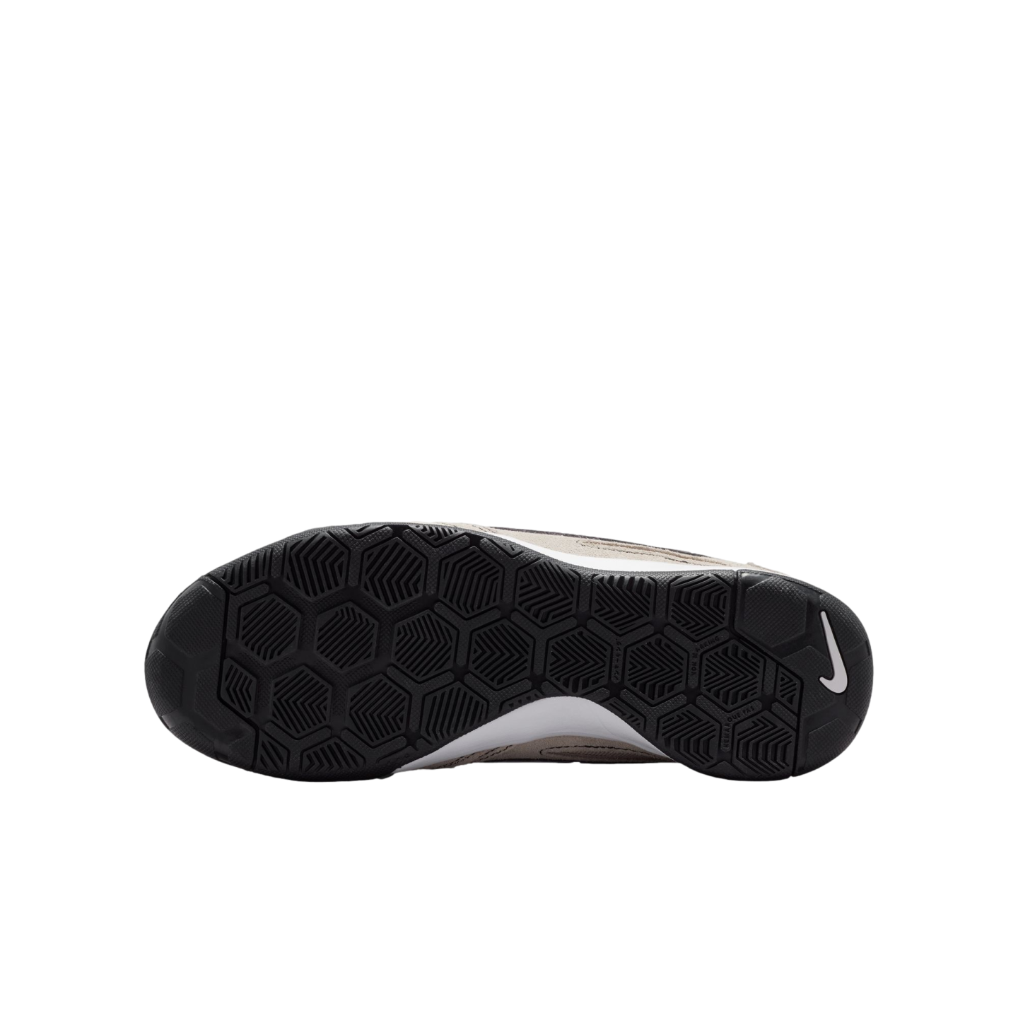 The bottom view of a Nike shoe's black rubber sole with a hexagonal tread pattern and white swoosh logo, shown against a solid black background.