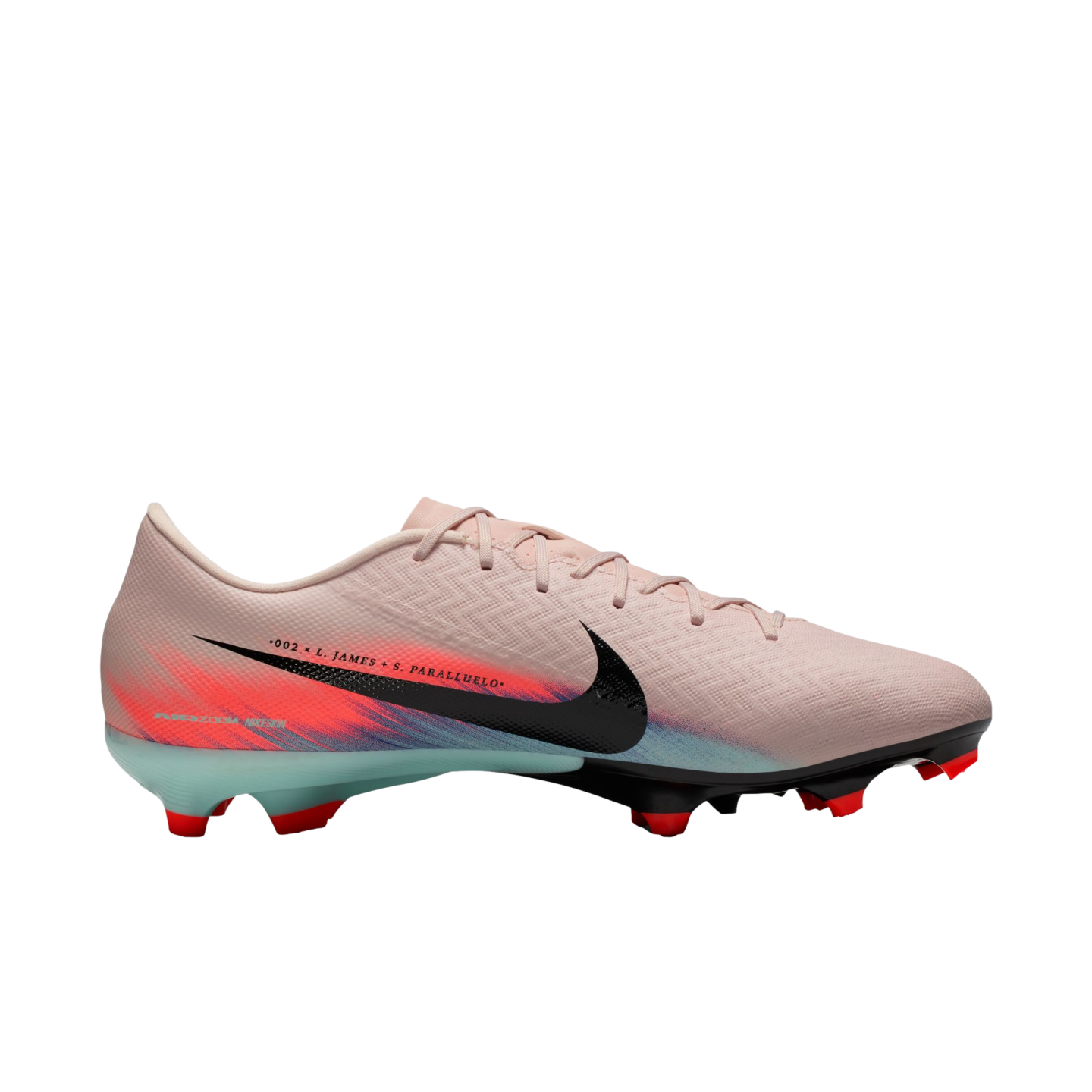 Side view of a light pink Nike soccer cleat with a black swoosh, red and blue heel graphics, and ".002 x L. JAMES + S. PARALLUELO" text.