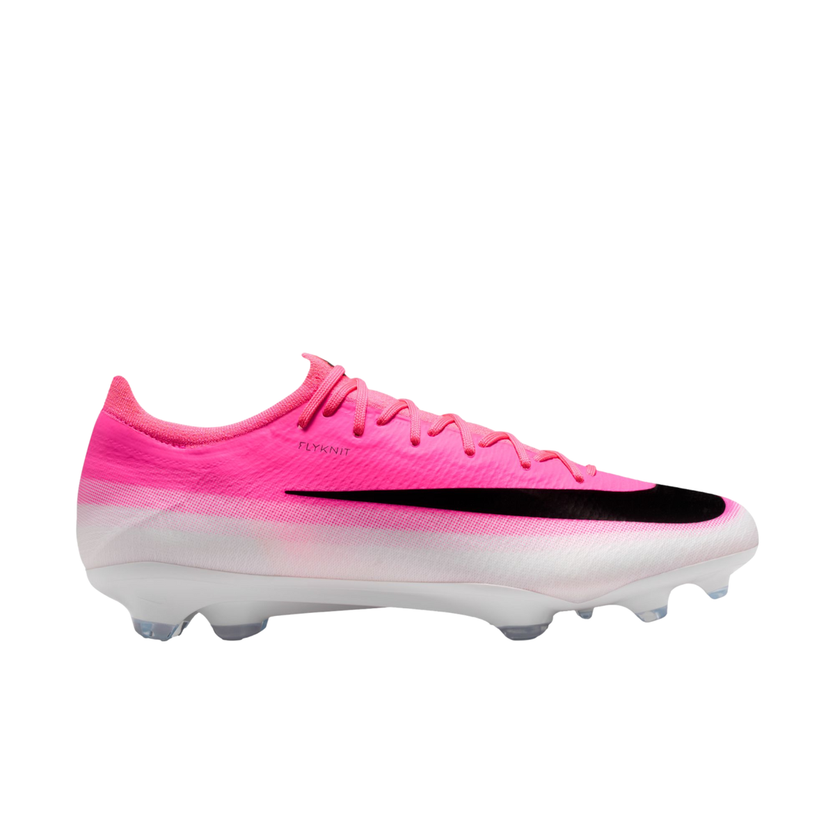 Side view of a pink and white Nike Flyknit soccer cleat featuring a large black swoosh and clear studs.