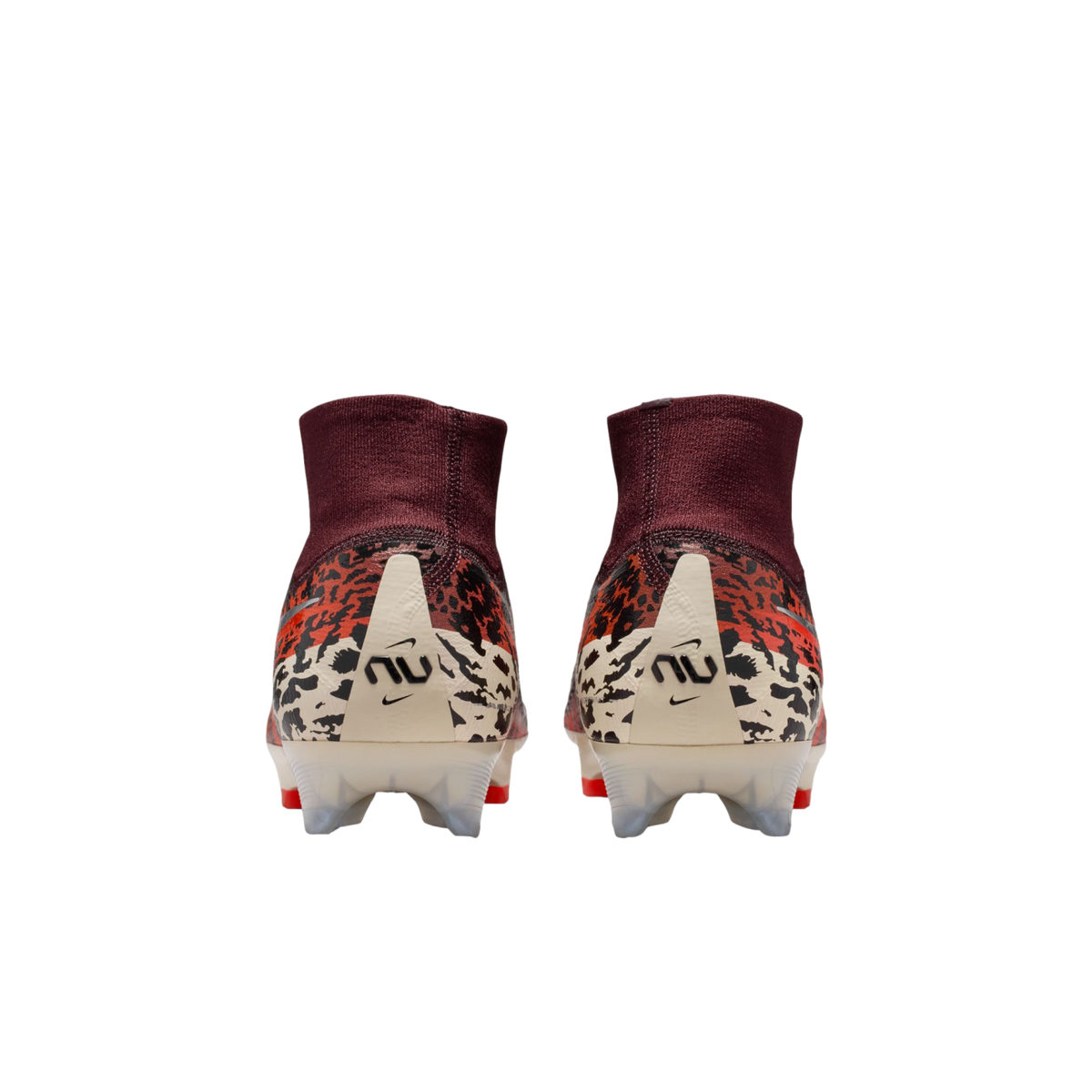 A rear view of a pair of Nike soccer cleats featuring high-top maroon ankle collars and animal print patterns in orange, black, and cream. Each cream-colored heel counter displays a stylized "NU" logo and a small Nike swoosh.