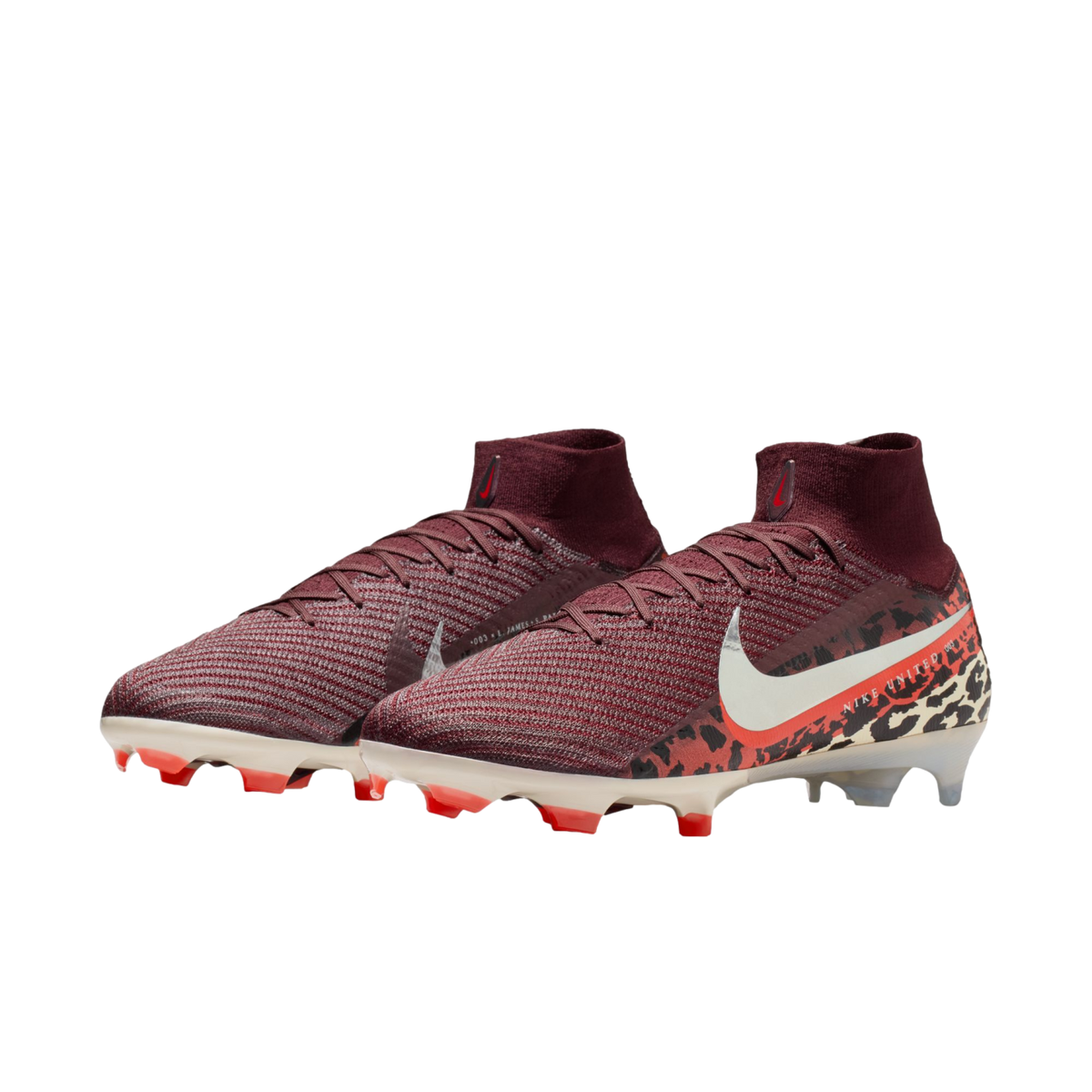 A pair of maroon Nike soccer cleats with a knitted texture and high-top collar, featuring a white swoosh and a bold animal print pattern on the heel, set against a solid black background.