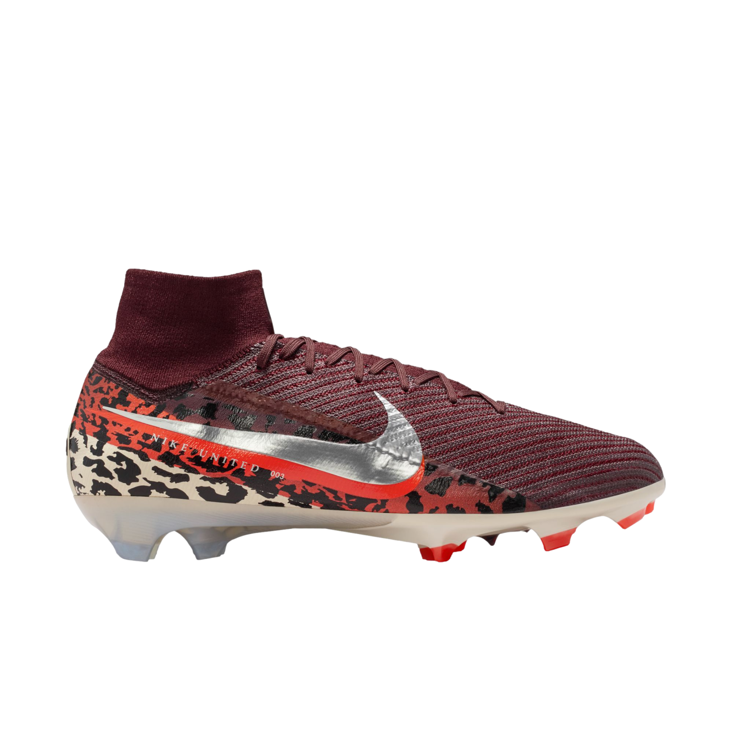 A high-top Nike soccer cleat is shown from a side profile against a solid black background. The shoe features a burgundy ribbed upper and a matching sock-like ankle collar. A large, metallic silver Nike swoosh with an orange border sits on the side, print