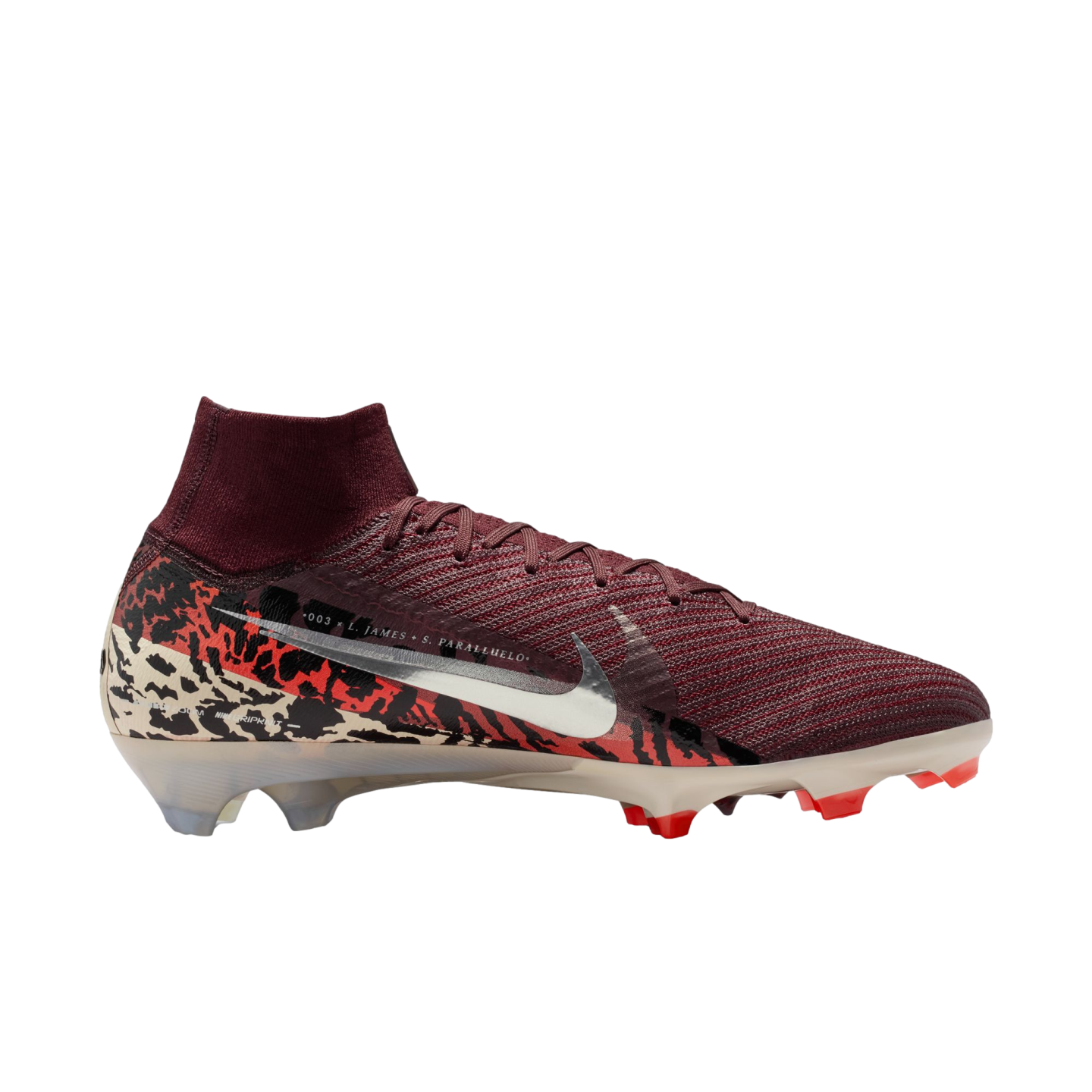 A side profile of a Nike Mercurial soccer cleat against a solid black background. The shoe features a textured burgundy knit upper with a high-top collar, a large metallic silver swoosh, and a heel wrapped in a bold black, red, and cream camouflage-like p