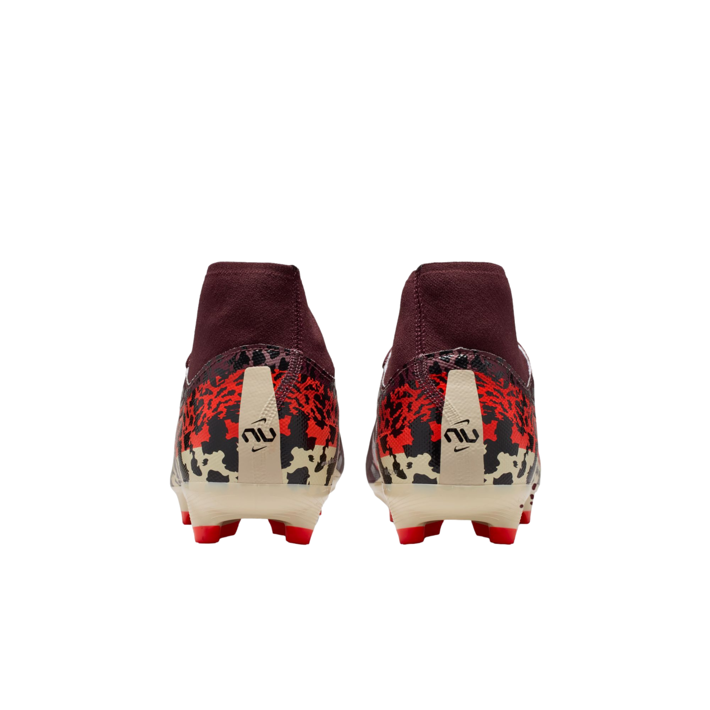 A rear view of a pair of maroon soccer cleats with a red, black, and cream graphic pattern on the heels. The boots feature a stylized logo on the back and red studs on a cream-colored sole, all set against a solid black background.