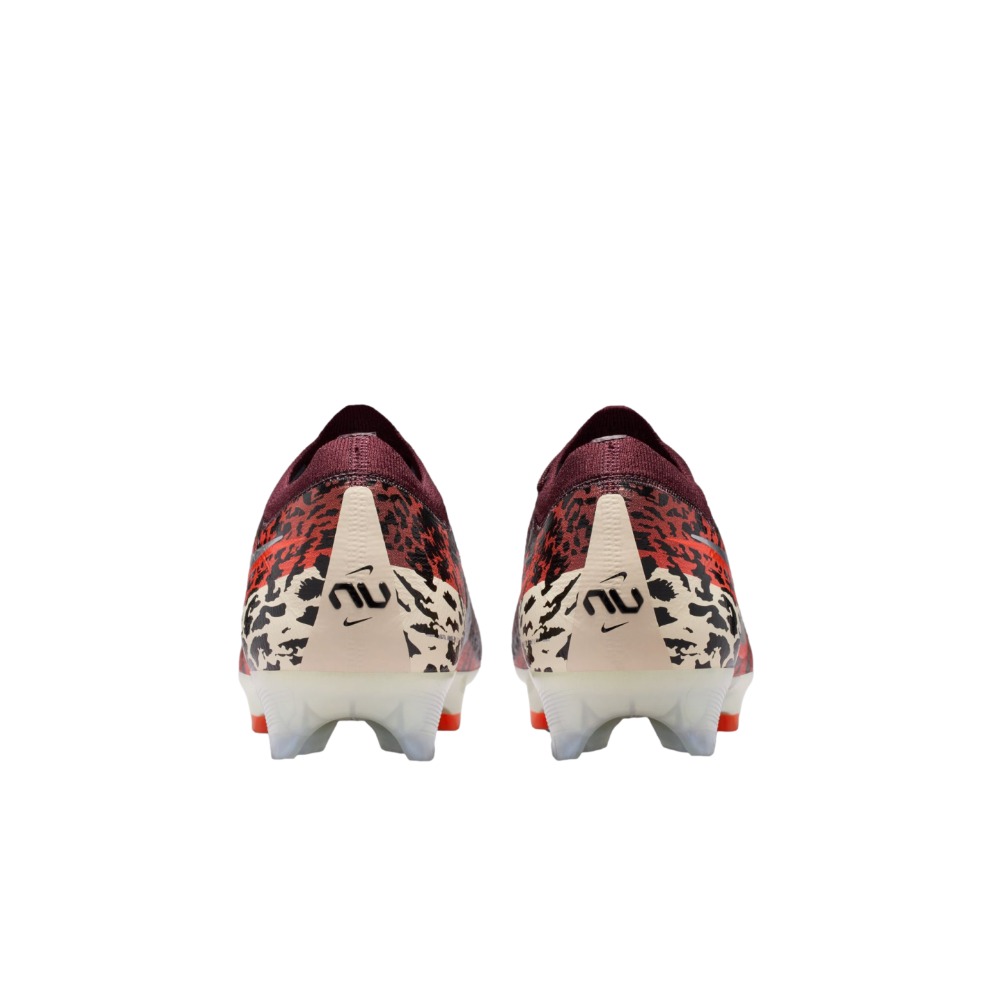 A rear-view of a pair of Nike soccer cleats against a black background. The shoes feature a maroon knit collar, a red and black leopard-print upper, and an off-white heel counter with a black "nu" logo. The translucent white studs have orange tips.