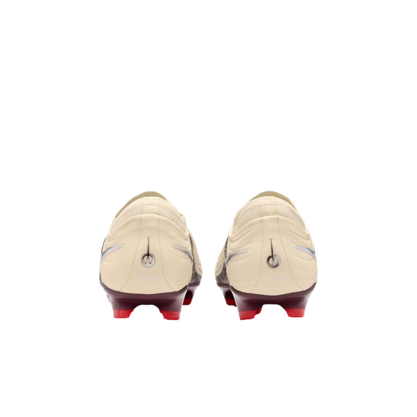A rear view of a pair of cream-colored soccer cleats with maroon heel plates and bright red studs, set against a solid black background.