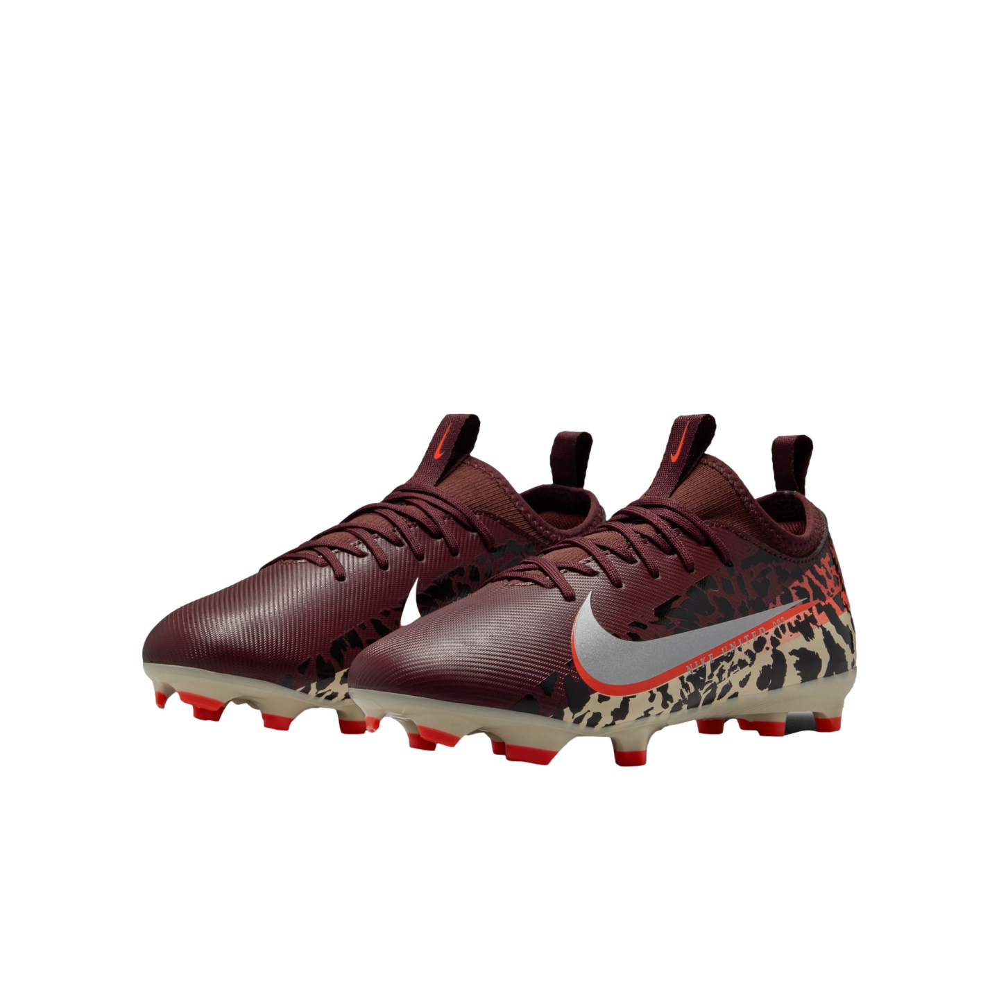 A three-quarter view of a pair of burgundy Nike soccer cleats with a silver swoosh and leopard-print heel details, set against a black background. The cleats have cream soles with bright red studs.