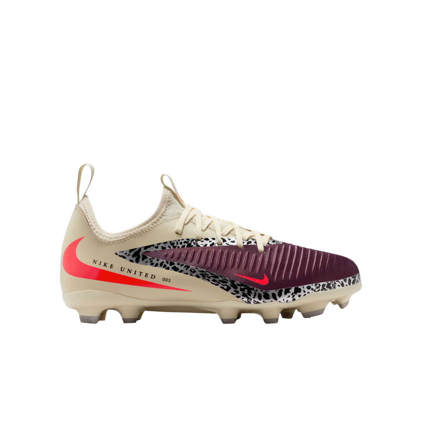 A side profile of a cream-colored Nike soccer cleat set against a solid black background. The shoe features a ridged burgundy toe box, a black-and-white leopard print accent stripe, and bright neon red swoosh logos. The side of the heel displays the text