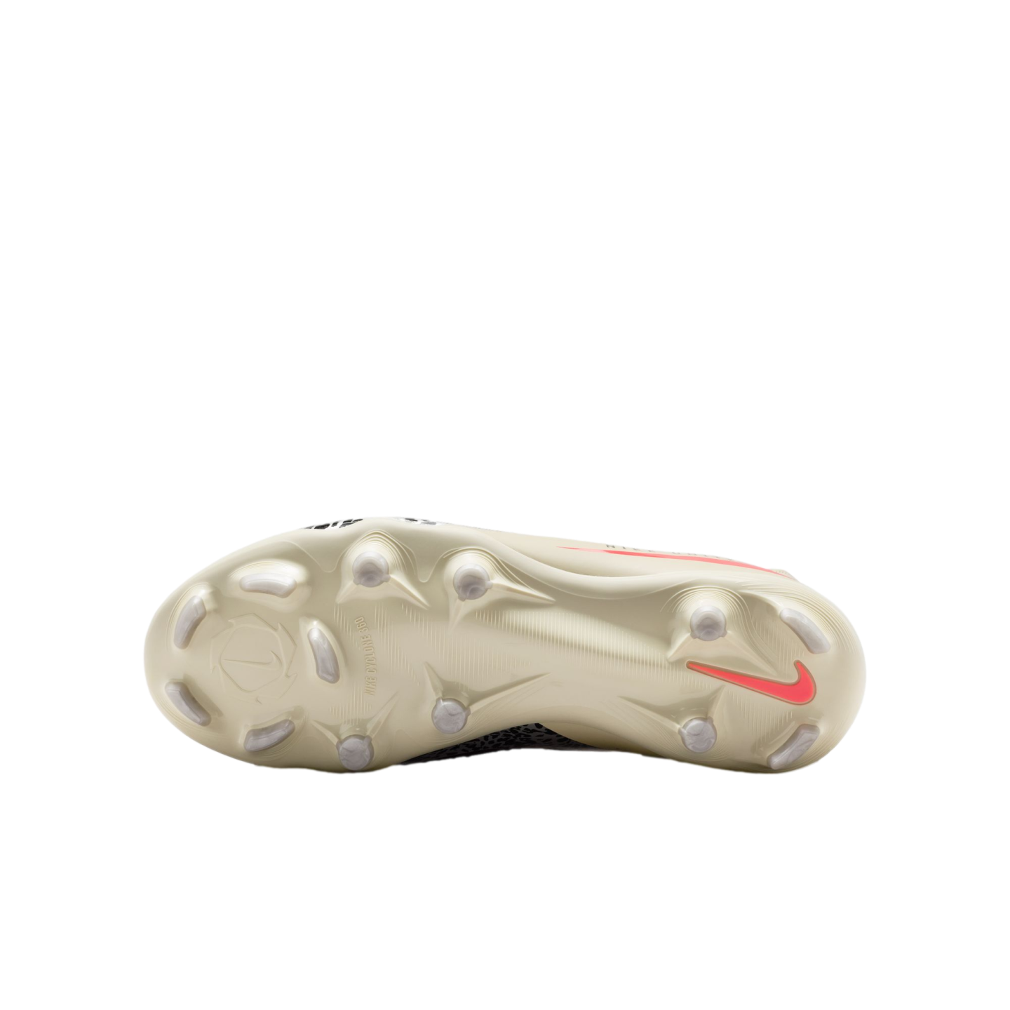 The cream-colored soleplate of a Nike football boot featuring a coral swoosh and various studs, centered against a black background.