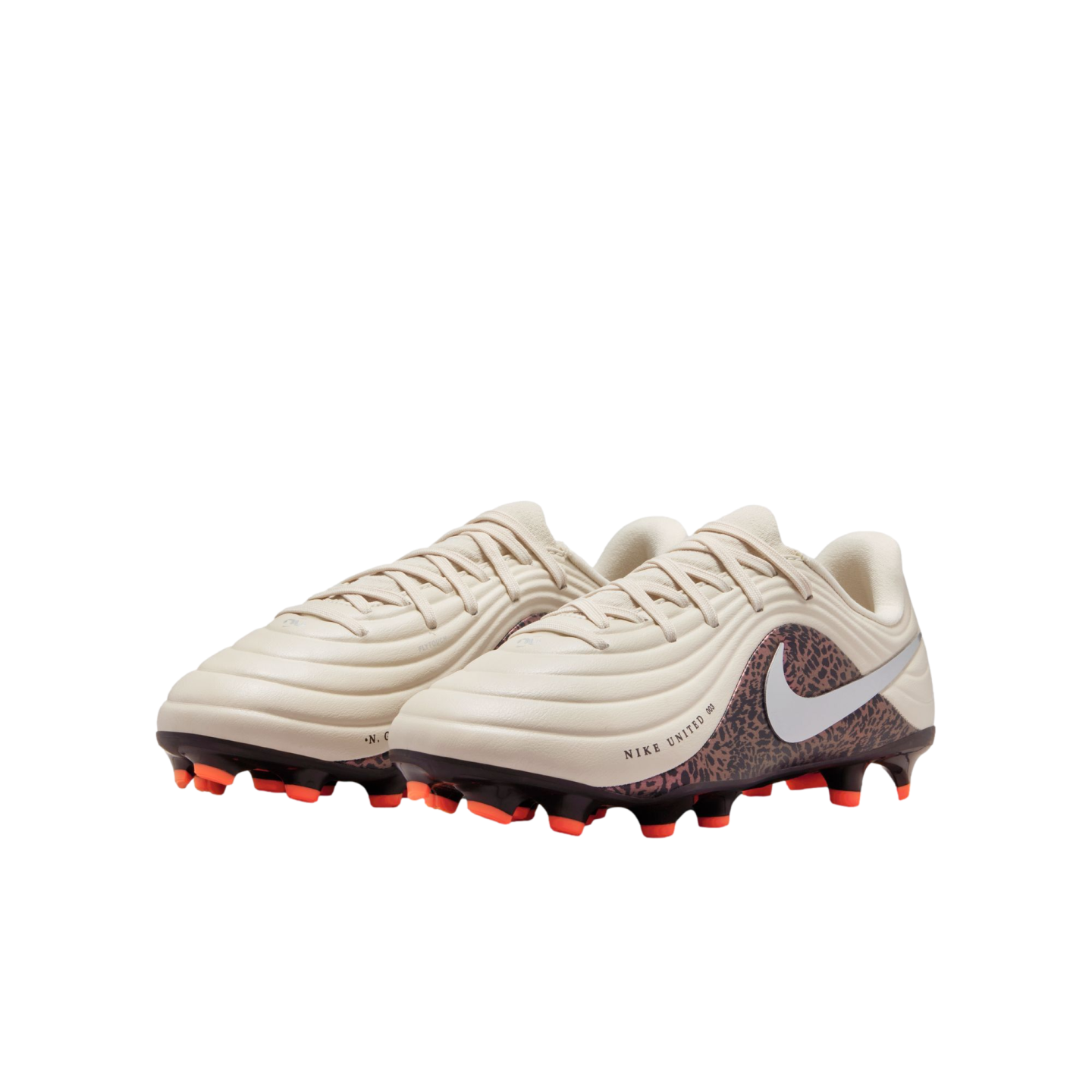 A pair of off-white Nike soccer cleats featuring a leopard print design on the heel and bright orange studs, set against a solid black background.