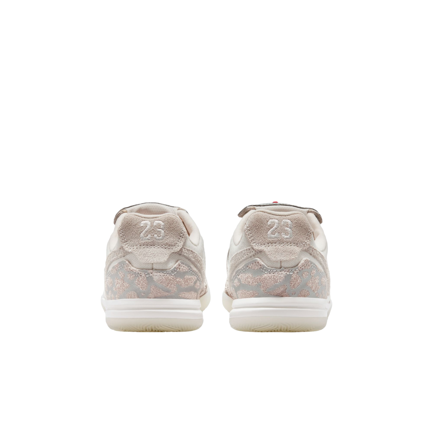 Rear view of two light-colored sneakers with "23" on the heels and a beige elephant print detail, set against a solid black background.