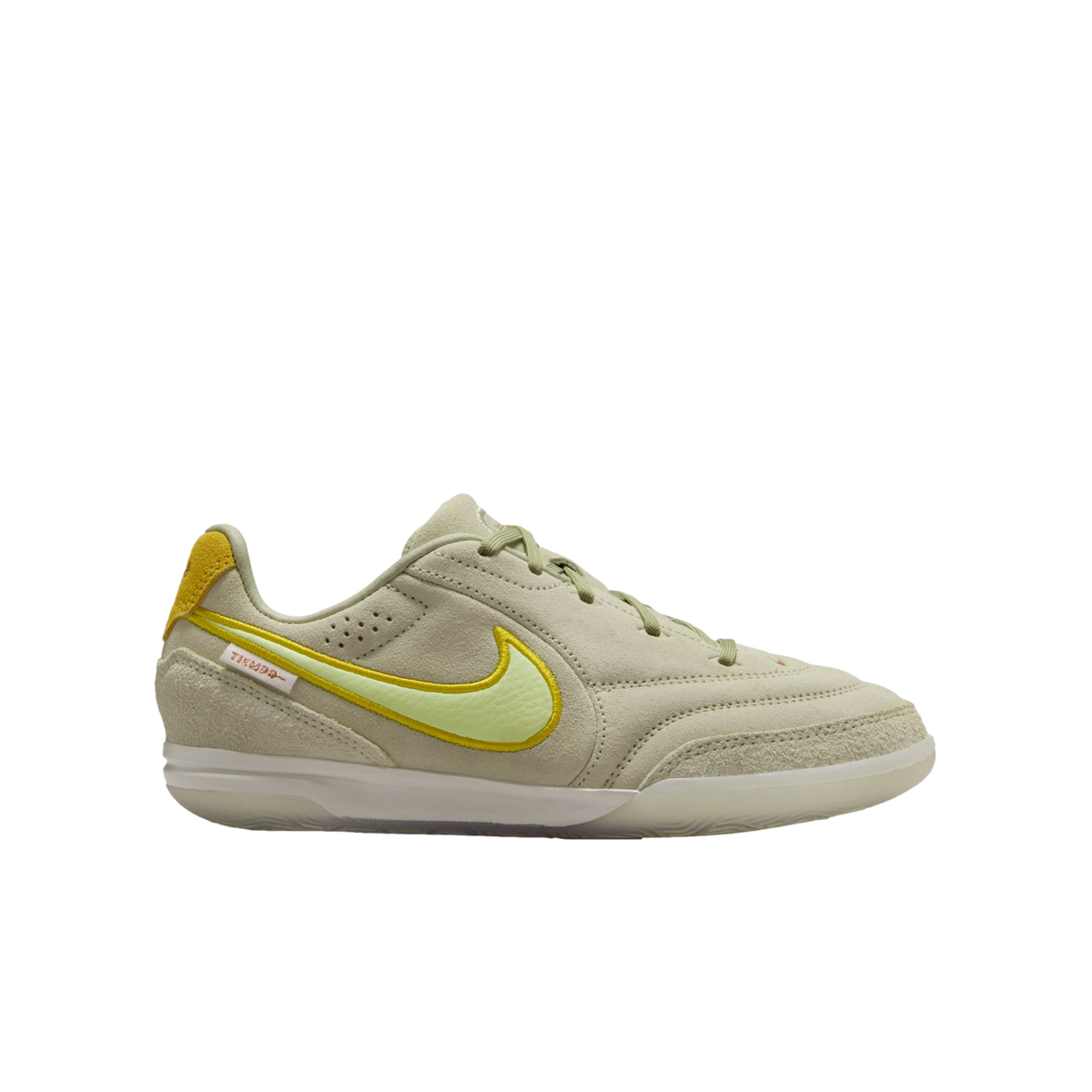 Side profile of a pale green Nike Tiempo suede sneaker with a bright yellow swoosh and white sole against a black background.
