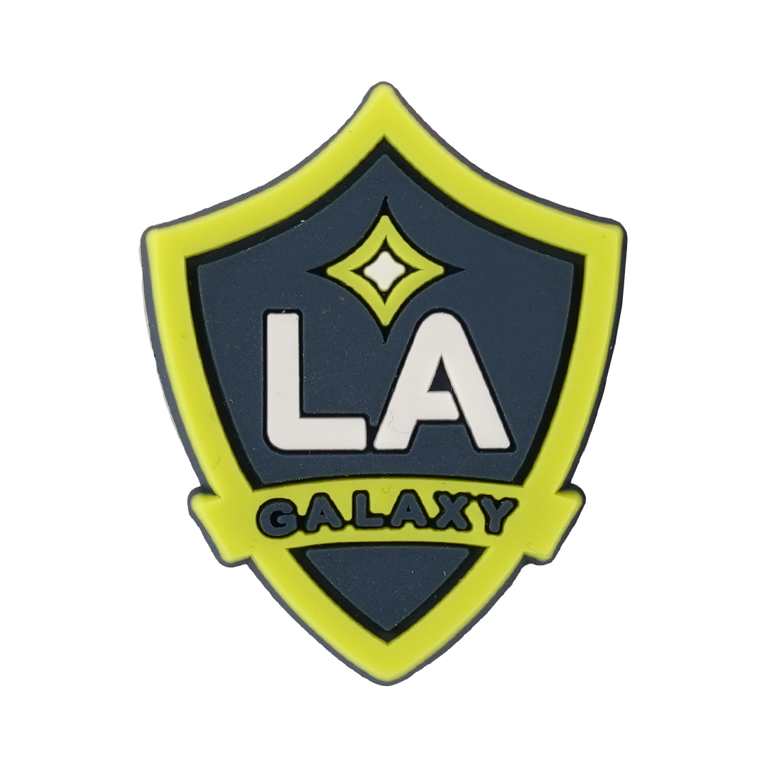 A Soccer Croc Charm featuring the LA Galaxy team logo on a navy blue and lime green shield.