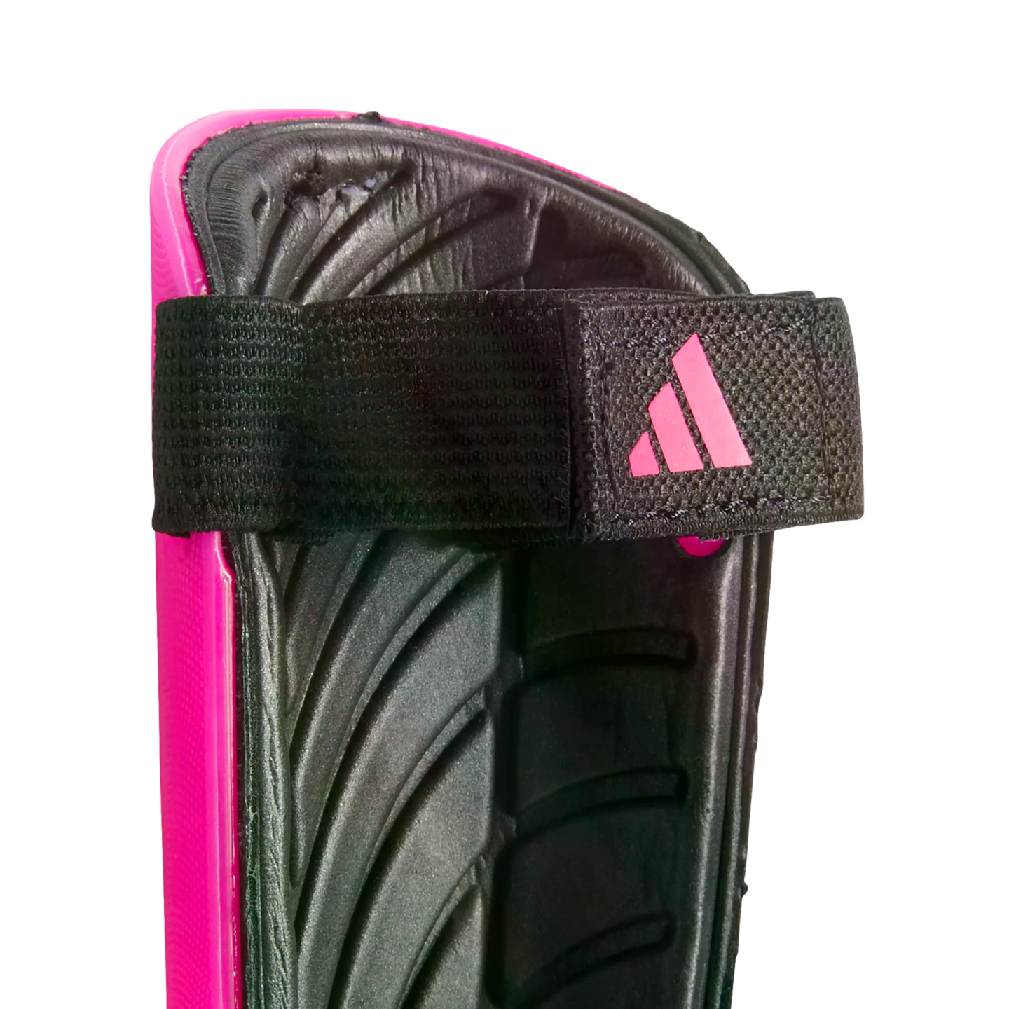 Close-up of a pink Adidas shin guard showing the black padded interior and an elastic strap with a pink logo.