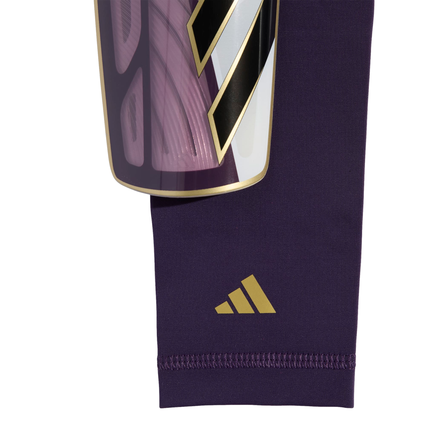 Close-up of a purple Adidas soccer shin guard and matching compression sleeve with gold accents against a white background.