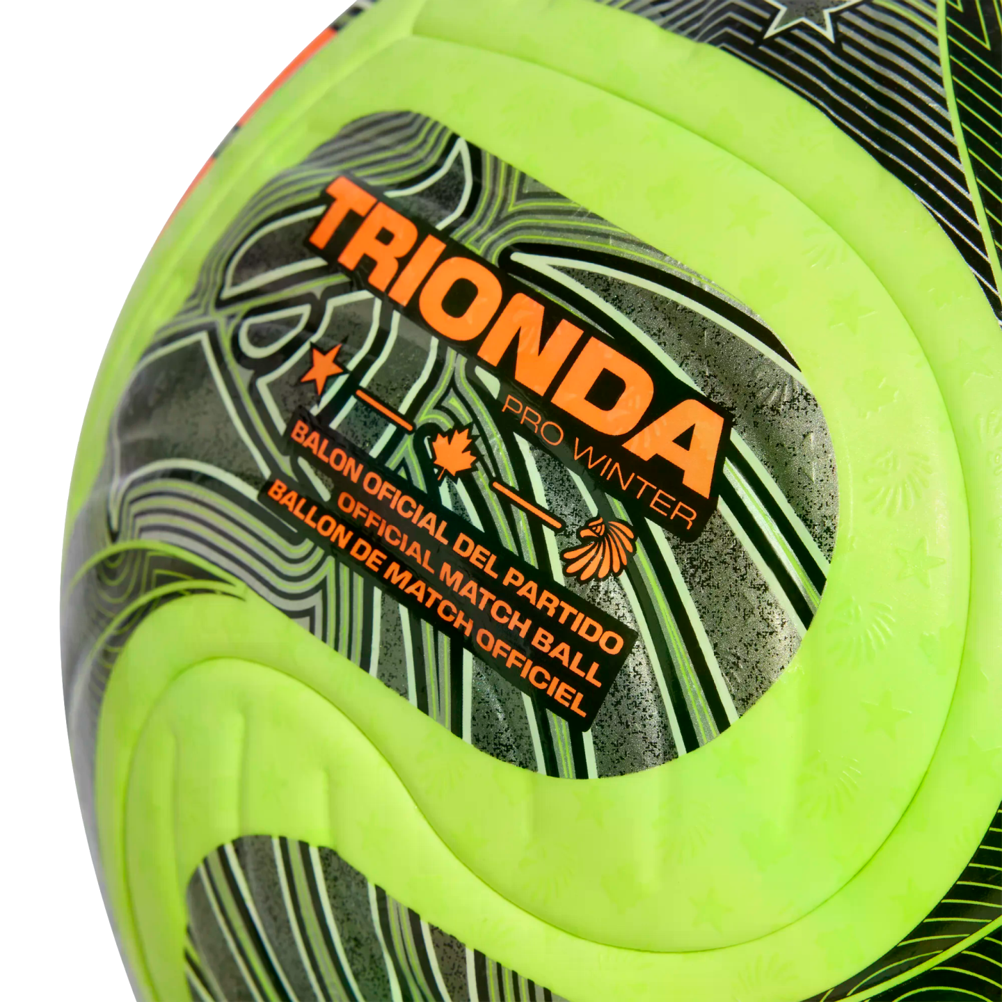 Close-up of a neon yellow and grey soccer ball branded "TRIONDA PRO WINTER" and labeled as an "OFFICIAL MATCH BALL" with orange graphic details.