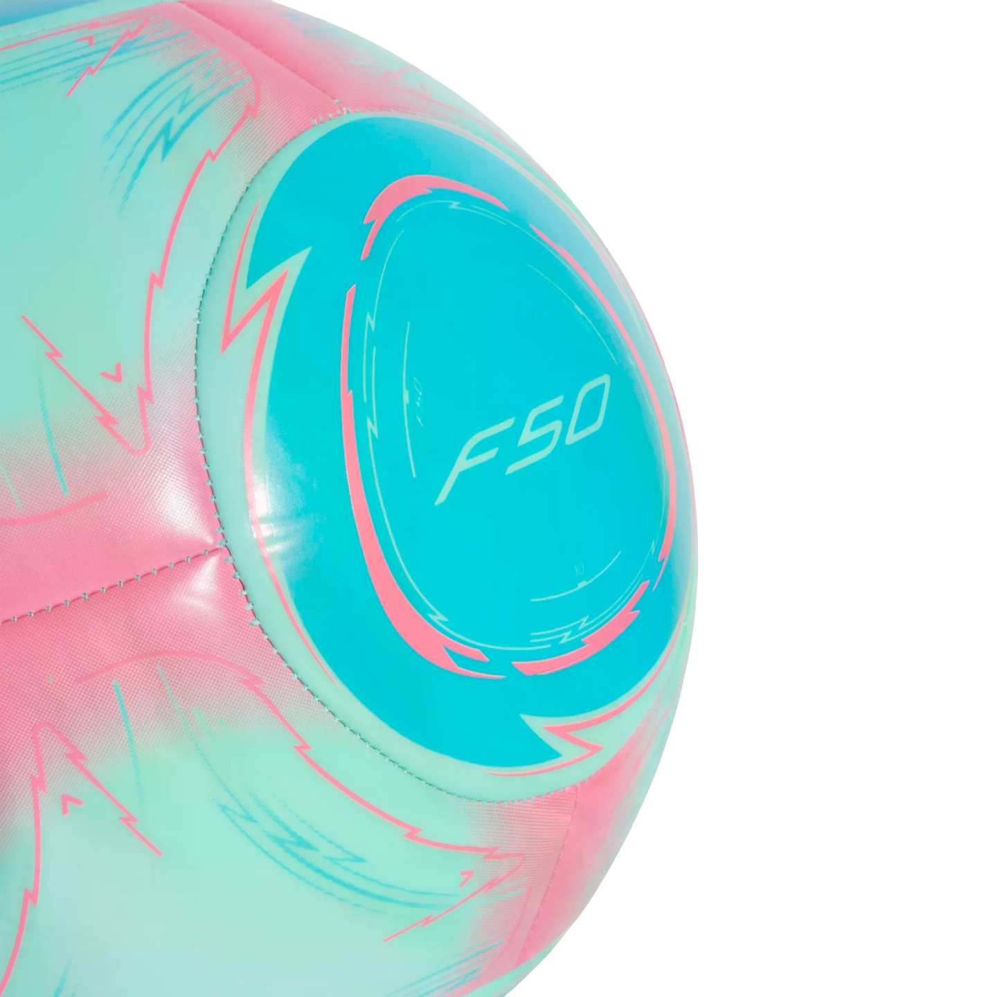 A close-up of a pink and teal Adidas F50 soccer ball featuring sharp, jagged graphic patterns.