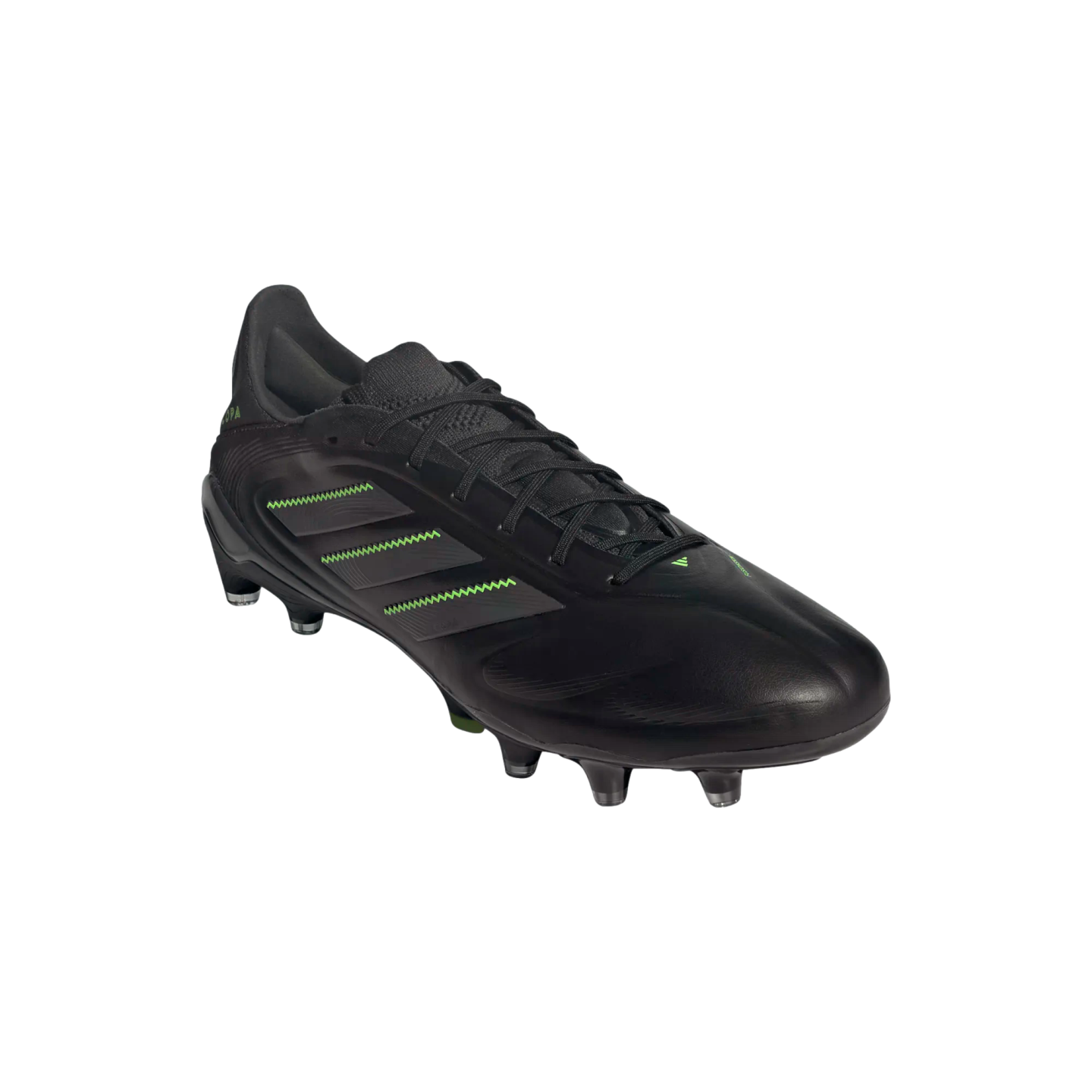A black Adidas Copa soccer cleat featuring green zig-zag accents on the three stripes, set against a solid black background.