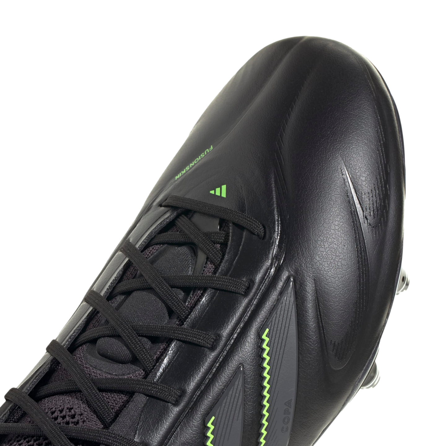 Close-up view of a black Adidas Copa soccer cleat with neon green accents and text. The shoe features black laces and a textured upper.