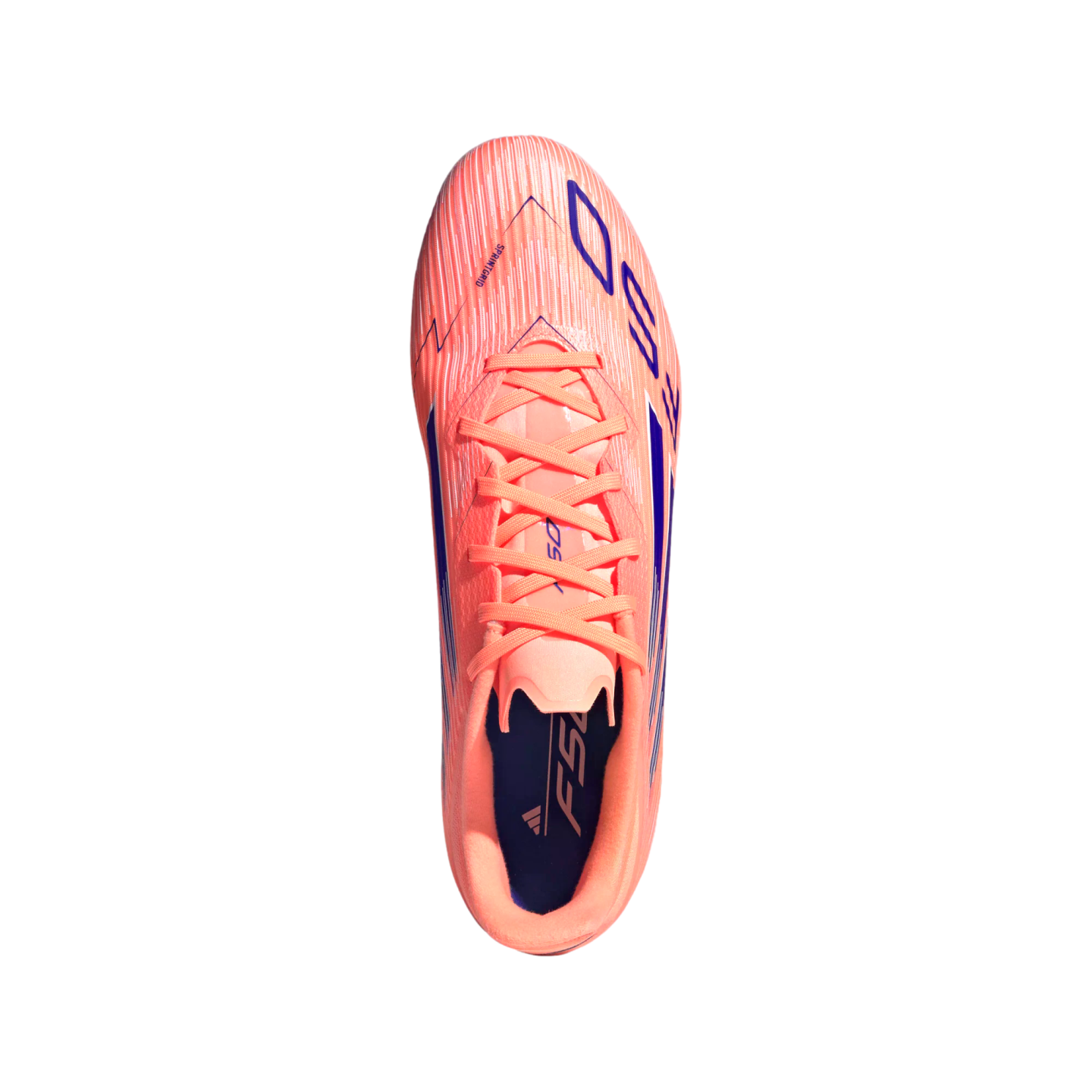 Top-down view of a salmon-pink Adidas F50 soccer cleat with purple accents and peach-colored laces, isolated on a black background.