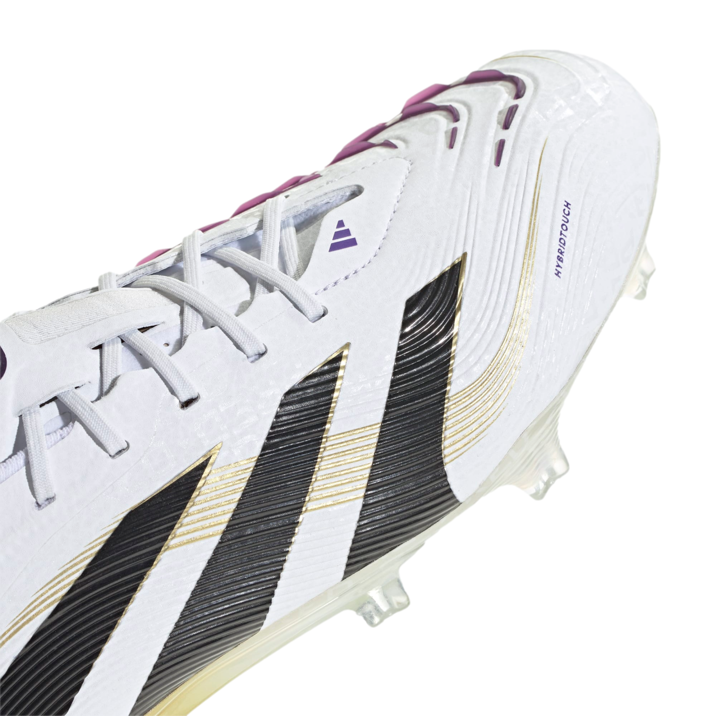 A close-up, angled view of a white Adidas soccer cleat featuring three diagonal black and gold stripes and purple accents.