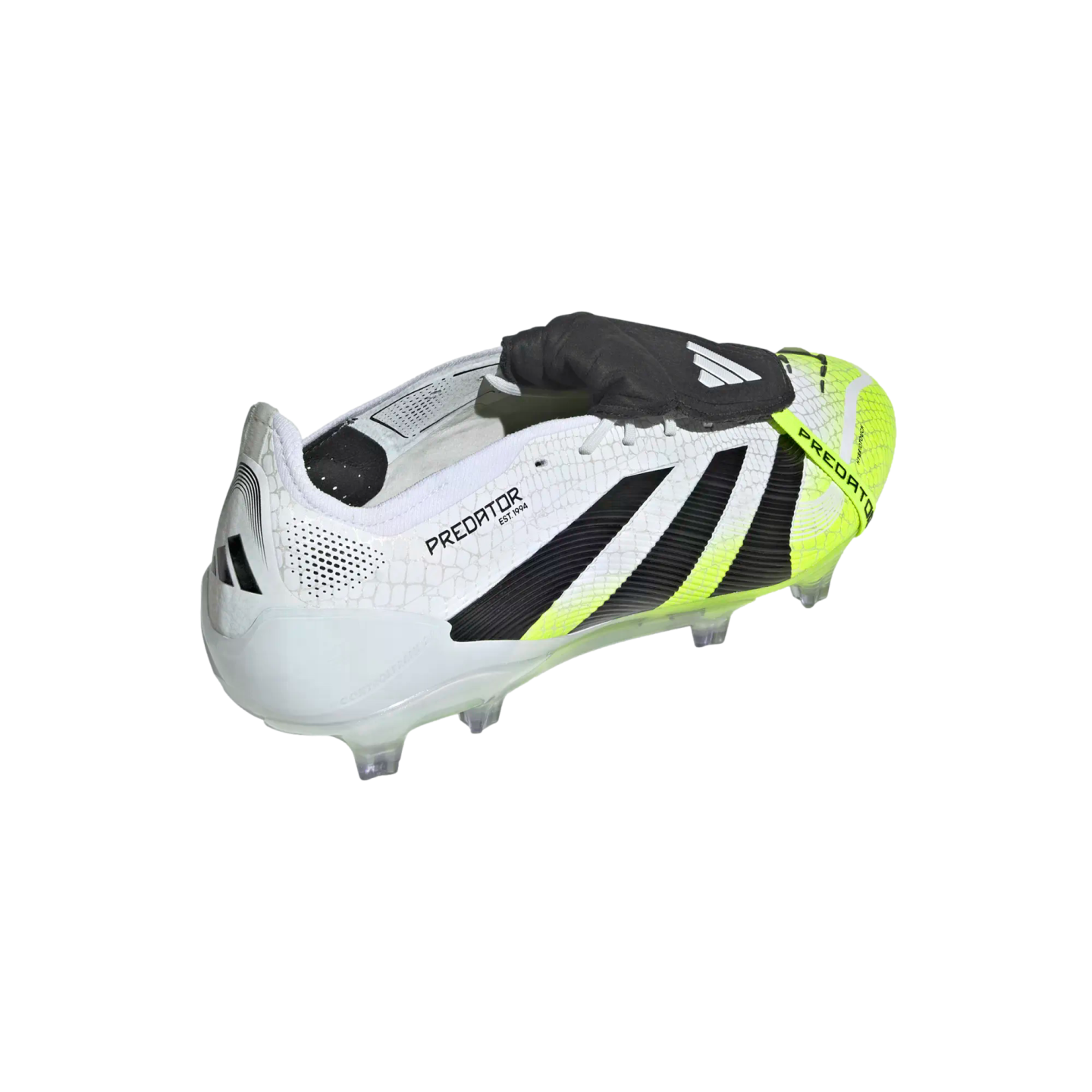 A white Adidas Predator soccer cleat with black stripes and neon yellow accents. It features a large black fold-over tongue and clear studs on the soleplate.