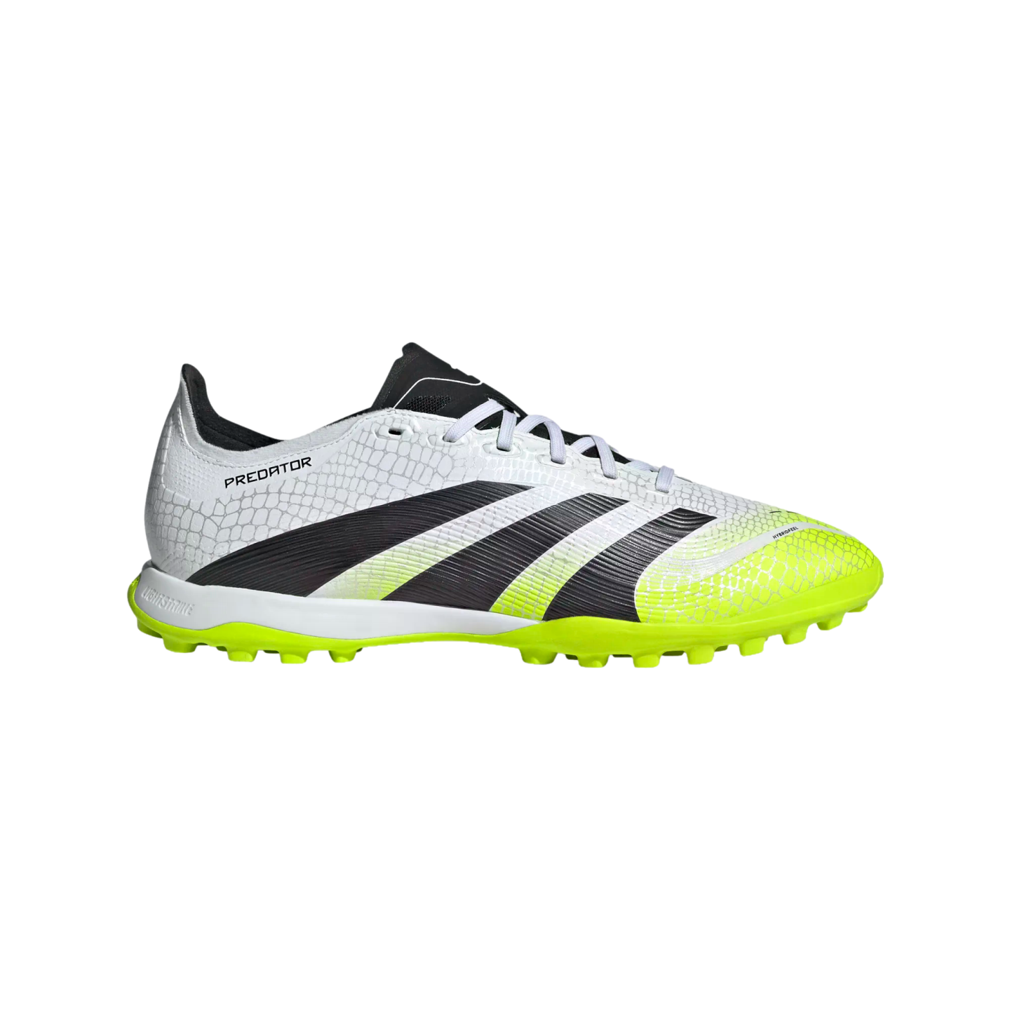 Profile view of a white Adidas Predator turf soccer shoe with a scaly pattern, large black diagonal stripes, and neon yellow accents on the toe and studded outsole.