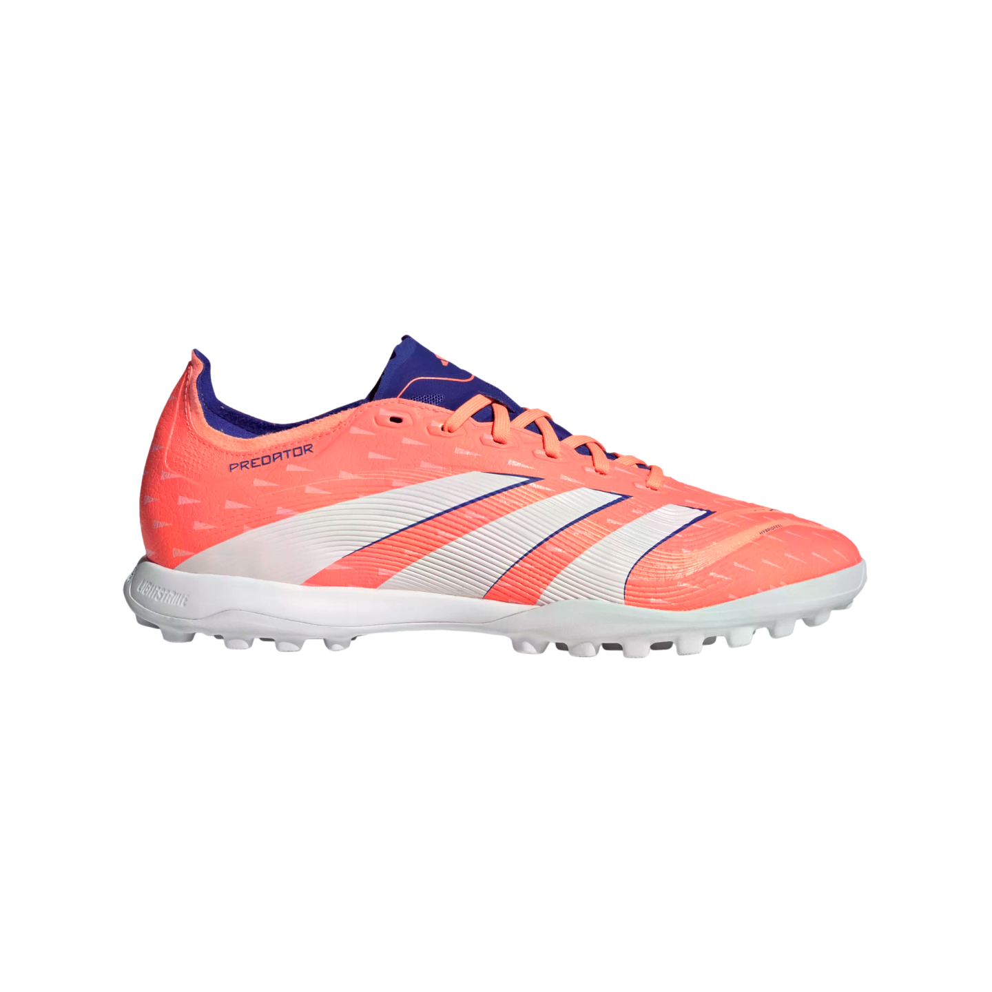 Profile view of a bright coral Adidas Predator soccer shoe with white stripes and purple details, featuring a turf-cleat sole, set against a black background.