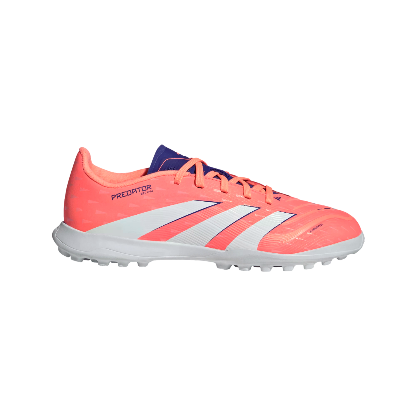 A coral Adidas Predator turf soccer shoe with white stripes, purple accents, and a white rubber studded sole, isolated on a black background.