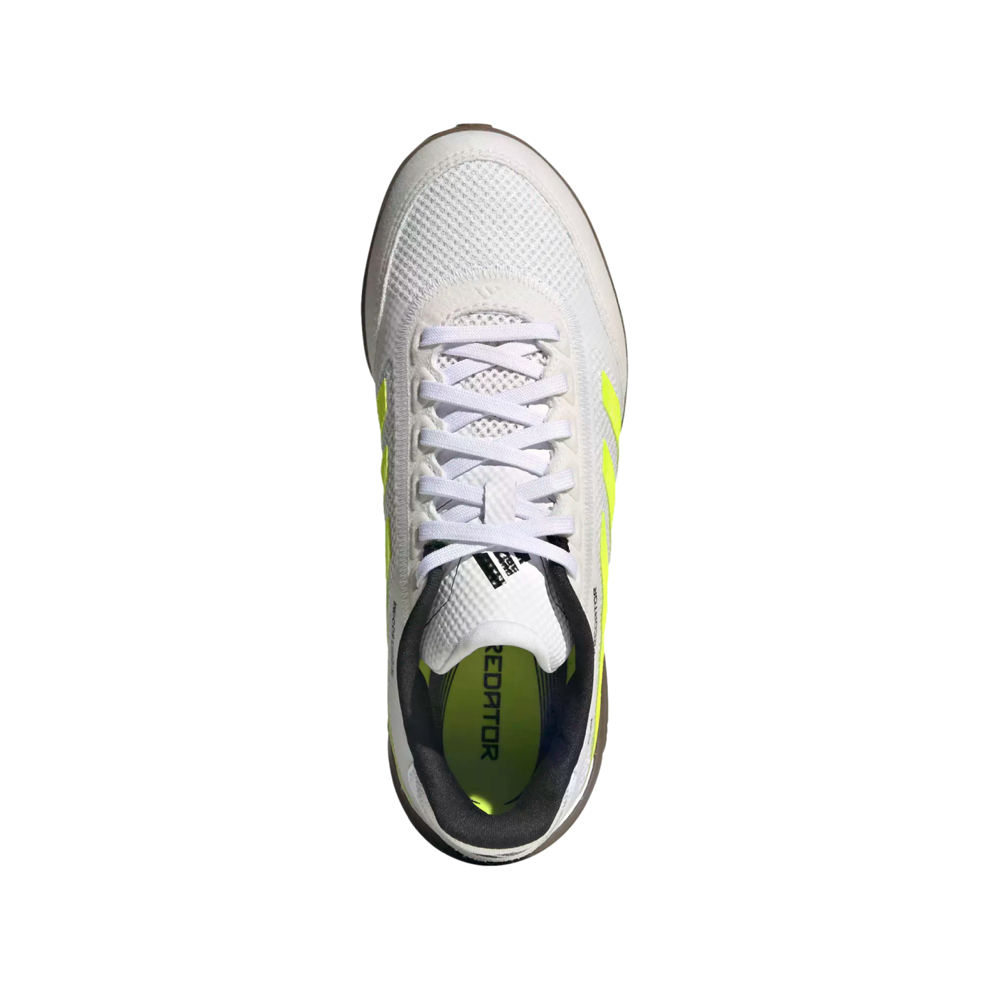 A top-down view of a white Adidas Predator indoor soccer shoe with neon yellow accents on a black background.