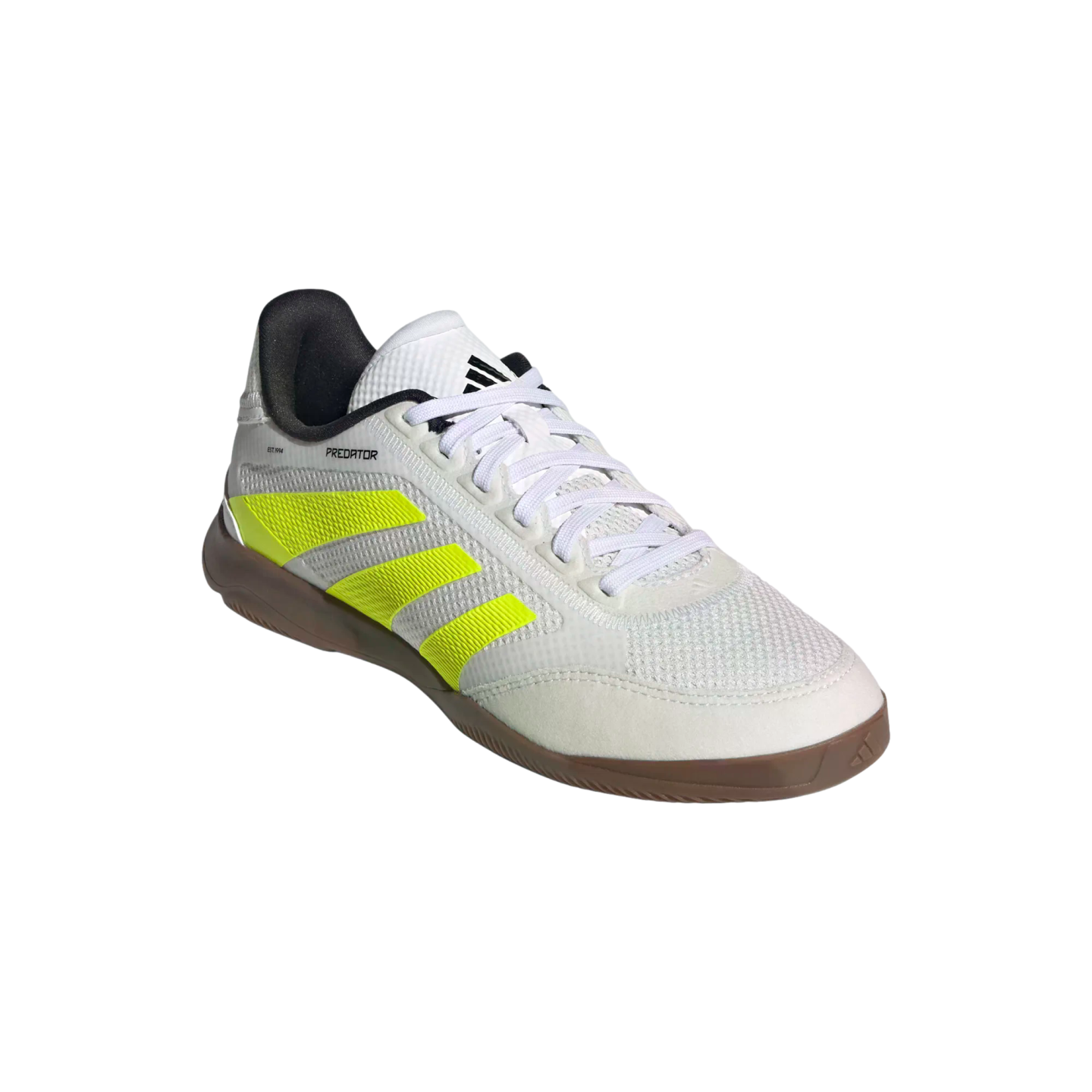 White Adidas Predator indoor soccer shoe with neon yellow stripes and a gum rubber outsole.