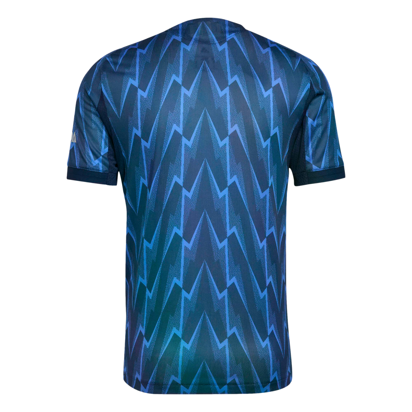 Back view of a blue soccer jersey featuring an allover navy and teal zig-zag lightning bolt pattern.