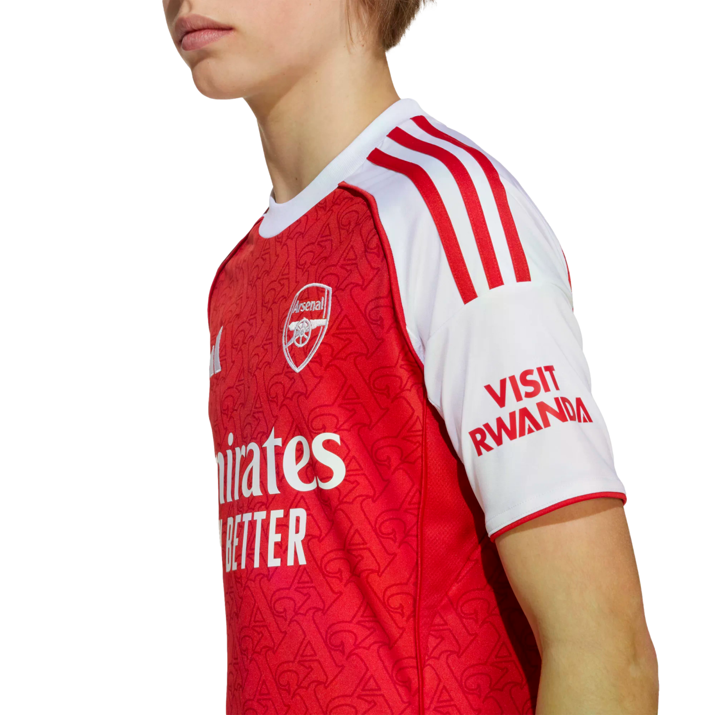 Side profile of a person wearing a red and white Arsenal FC home football jersey with the club crest and sponsors visible against a white background.