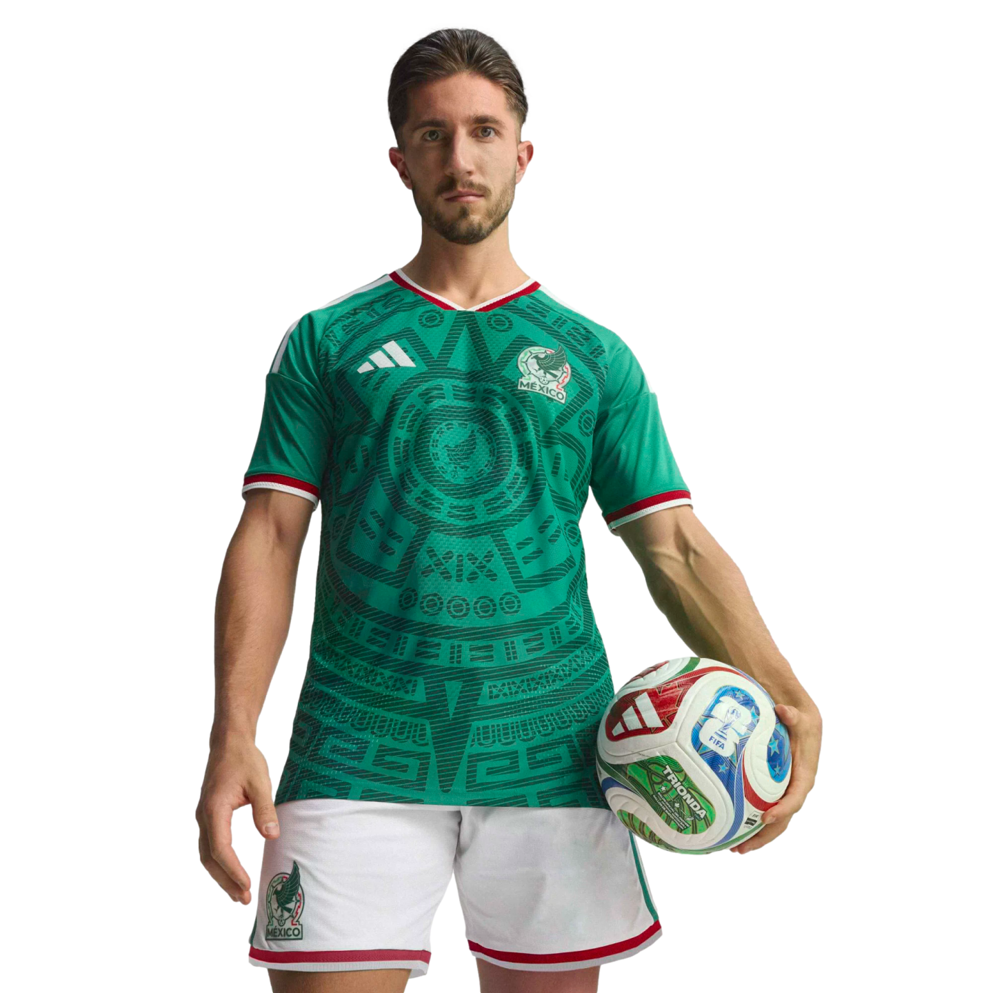 A male soccer player poses in a green Mexico national team jersey and white shorts, holding a soccer ball against a black background.