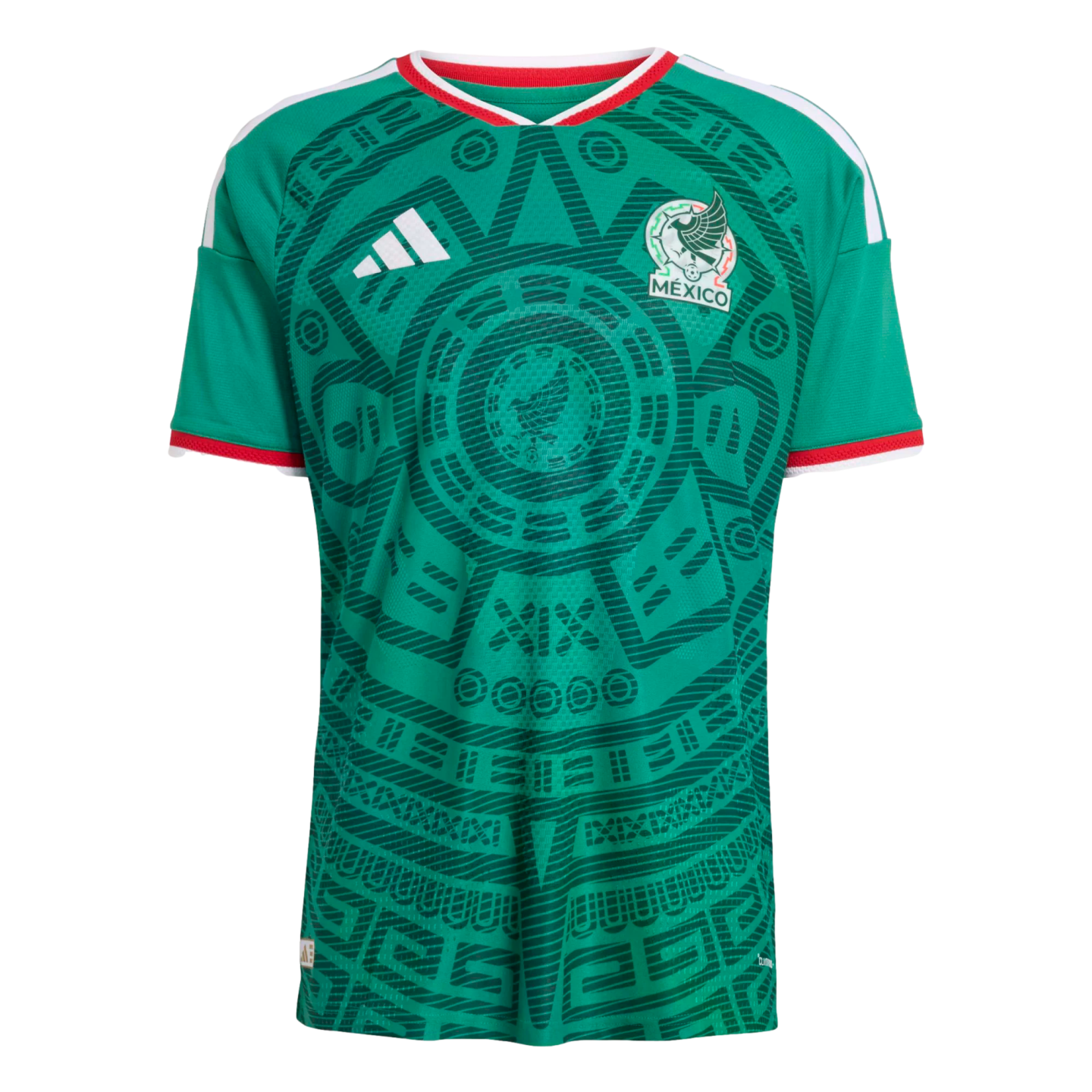 A green Mexico soccer jersey with an intricate dark green Aztec-style pattern, white Adidas logo, Mexico crest, and red and white trim on the collar and sleeves.