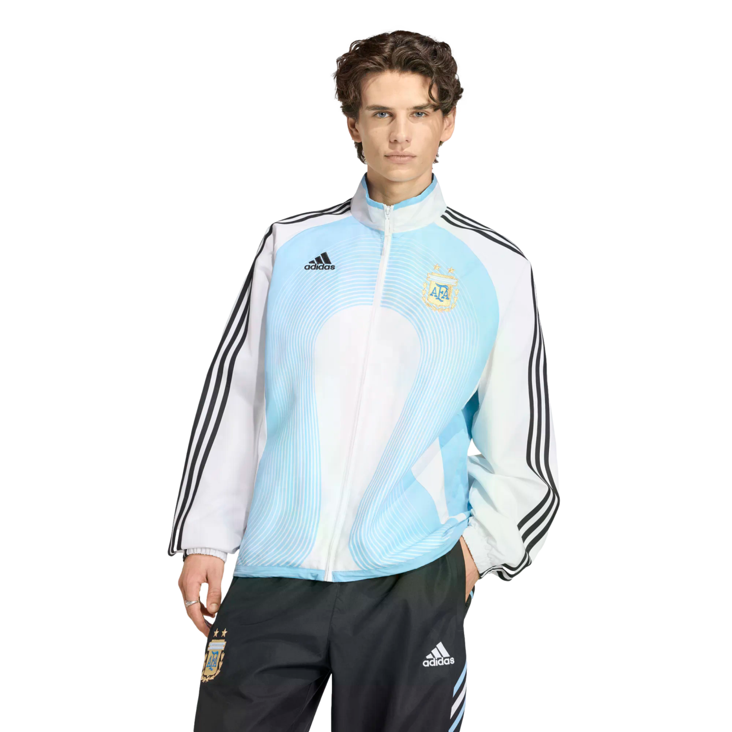 Man modeling a light blue and white Adidas Argentina national team track jacket and black track pants against a black background.