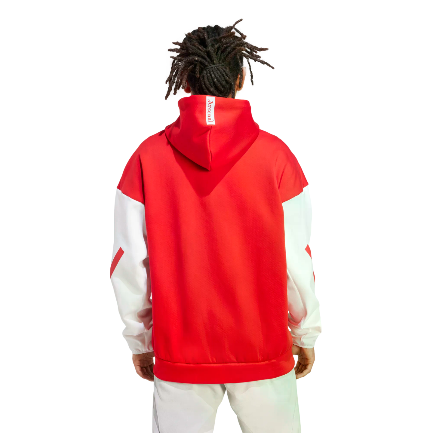 Back view of a person with dreadlocks wearing a red and white Arsenal hoodie and light-colored pants against a white background.