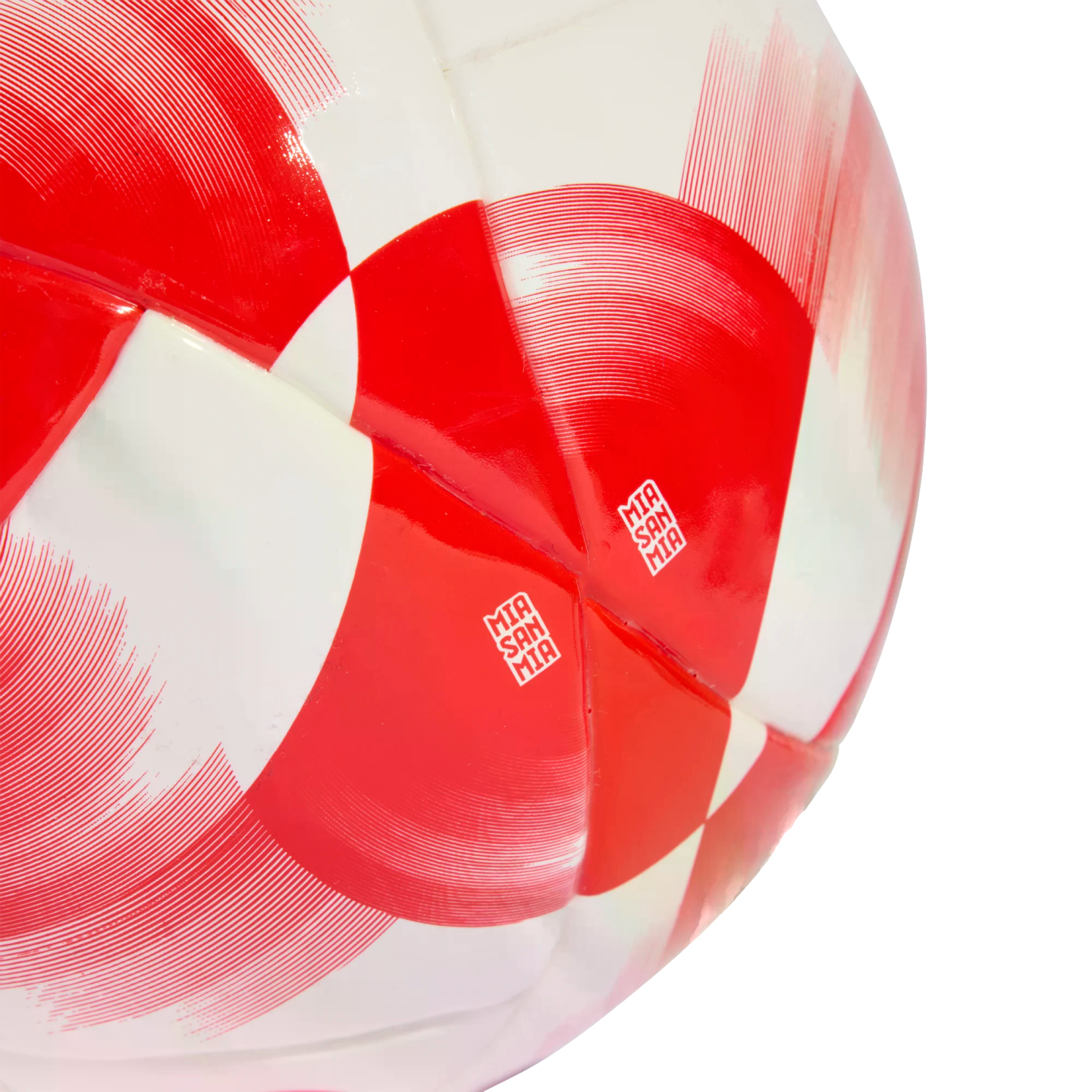 Close-up of a red and white soccer ball featuring a glossy, geometric pattern and the text "MIA SAN MIA" on its panels.