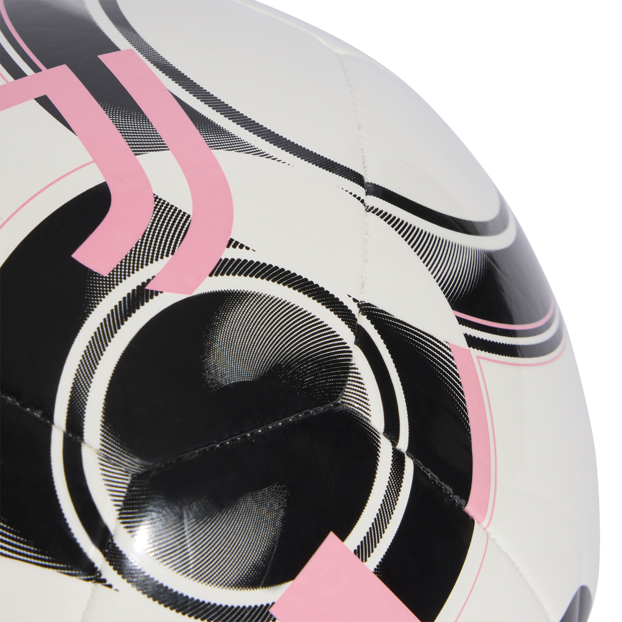 Close-up view of a white Juventus soccer ball featuring black and pink graphic designs and the stylized "J" logo.