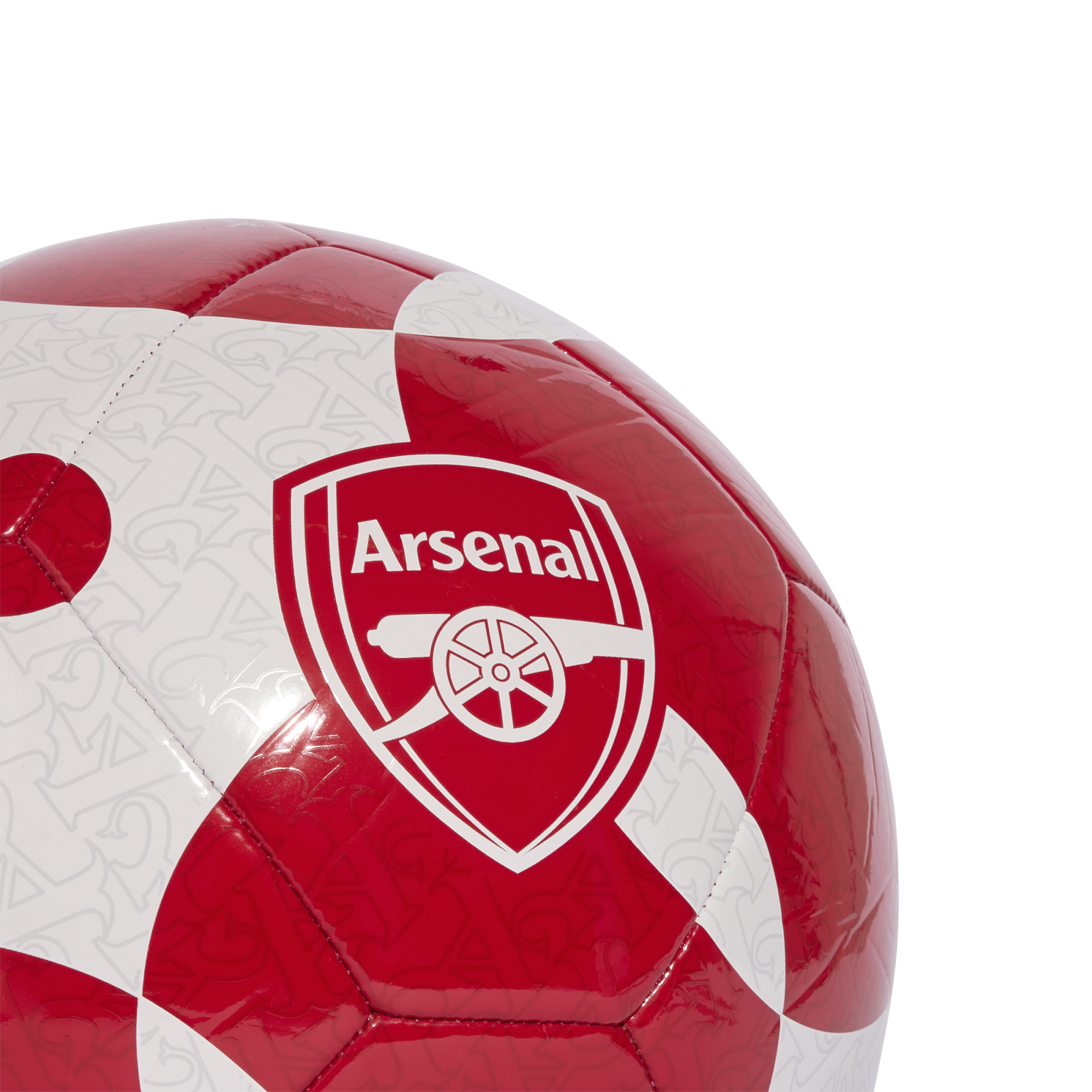 Close-up of a red and white soccer ball with a geometric pattern, featuring the Arsenal Football Club crest.