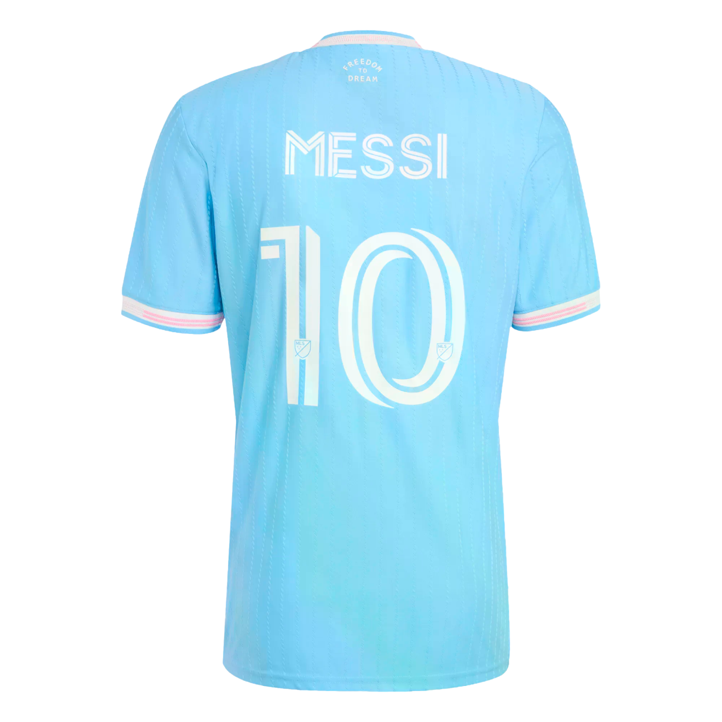 Back of a light blue soccer jersey with 'MESSI' and number '10' in white. It has pink accents on the sleeves and collar and 'Freedom to Dream' printed at the top center.