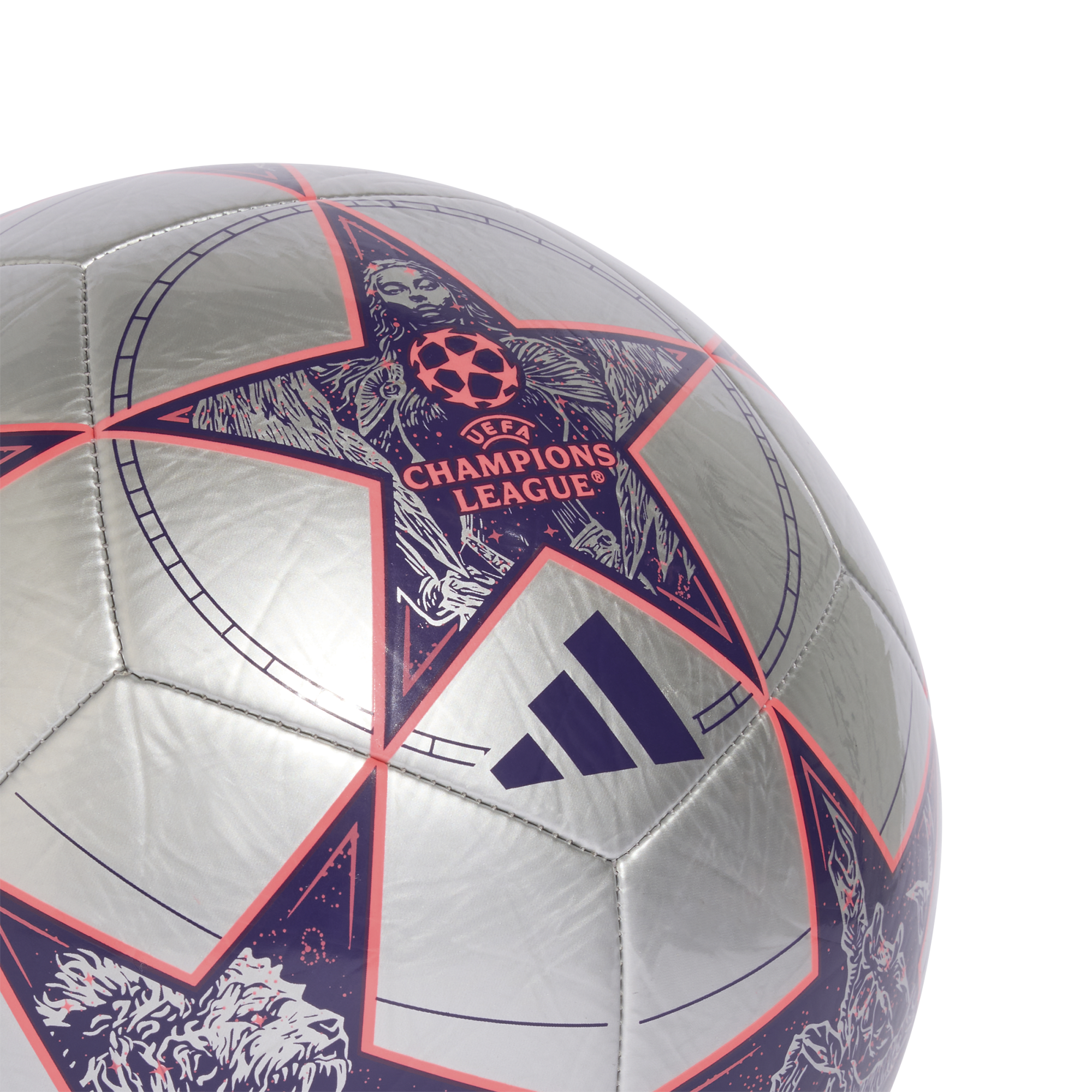 Close-up of a silver Adidas UEFA Champions League soccer ball featuring large purple stars with orange outlines and intricate graphics.