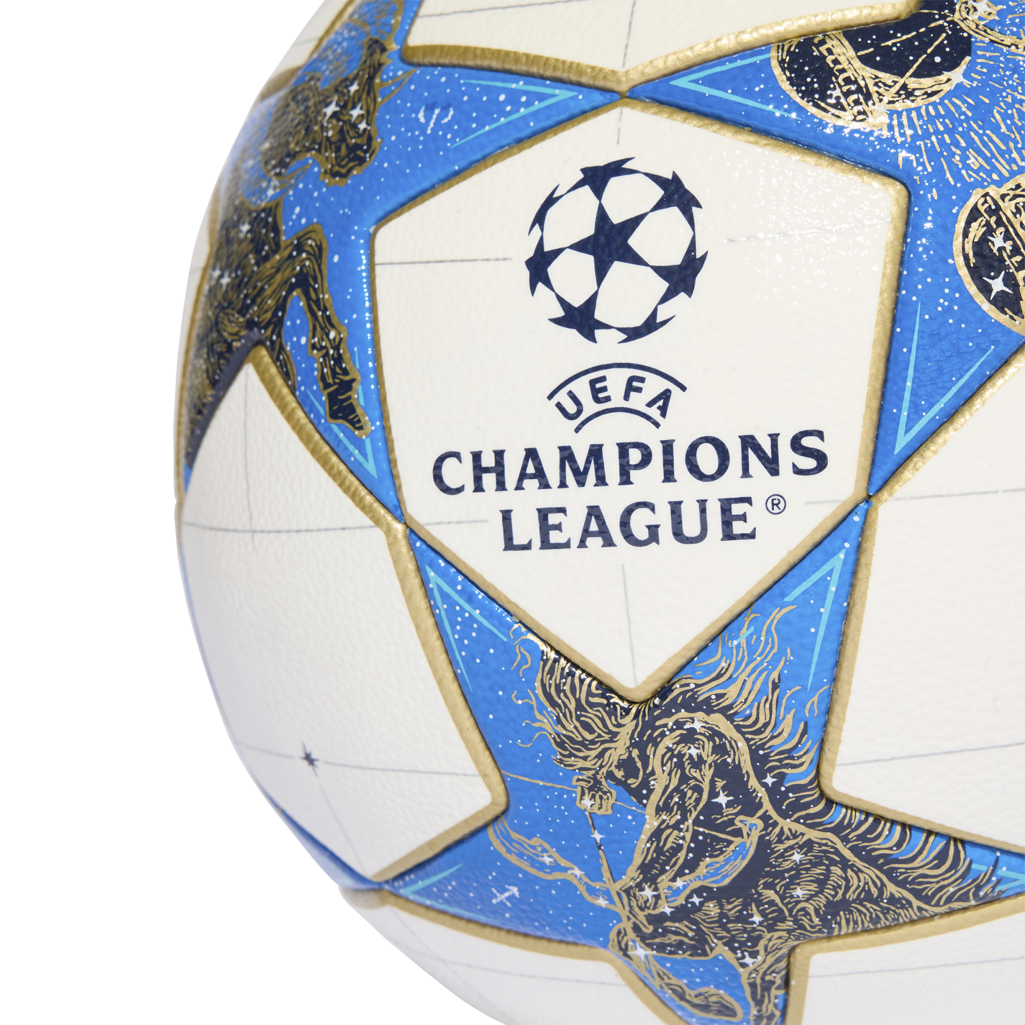 Close-up of a UEFA Champions League soccer ball featuring white panels with the tournament logo and blue star-shaped panels detailed with gold mythological illustrations.