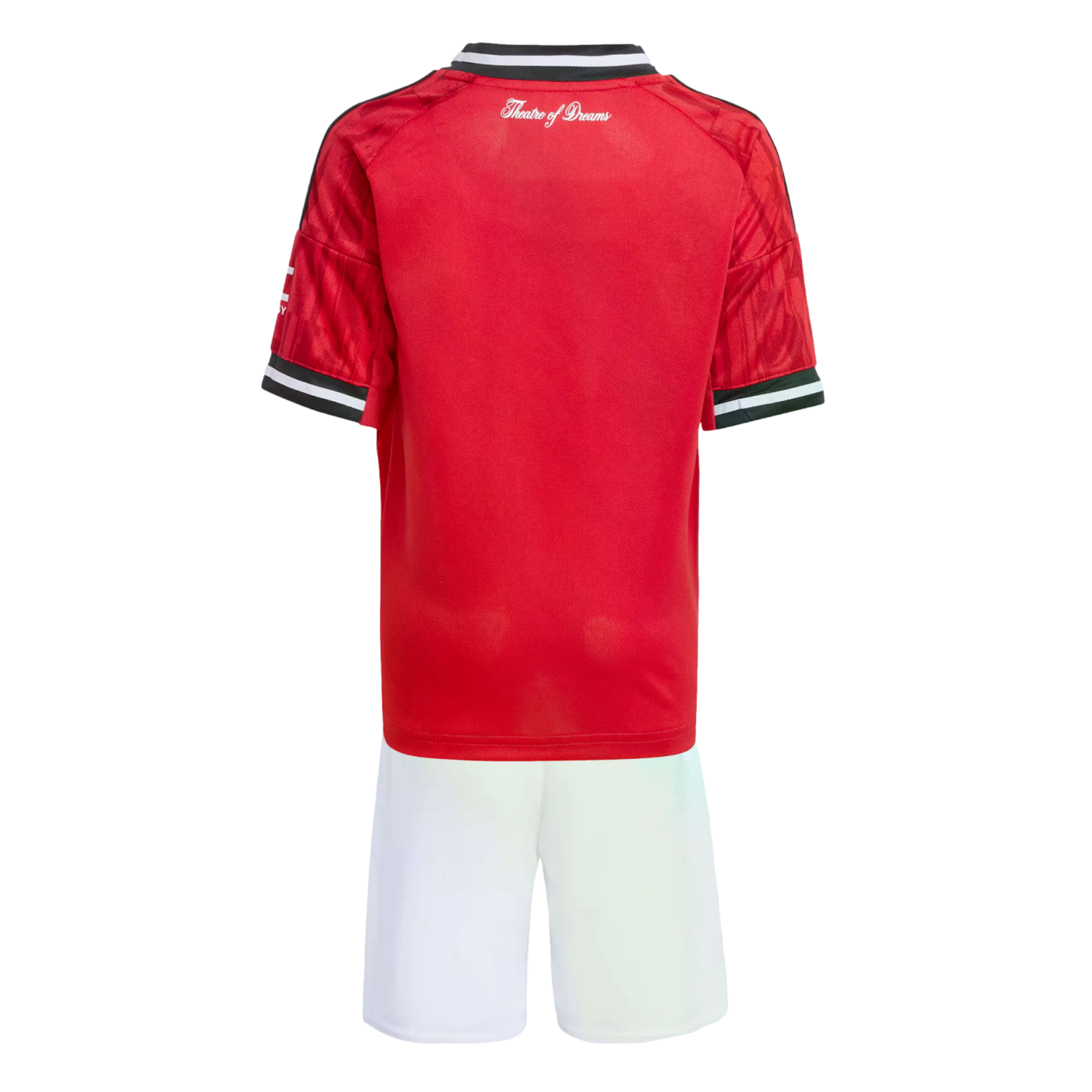 Back view of a red football kit with white script reading "Theatre of Dreams" on the upper jersey, paired with white shorts.