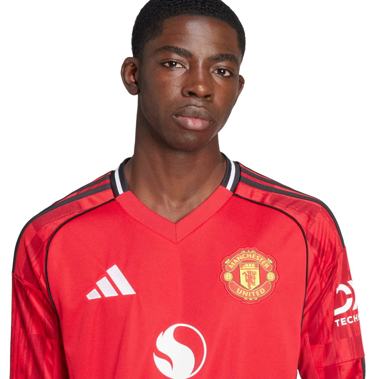 Headshot of a young Black male athlete wearing a red Manchester United jersey with the club crest and Snapdragon sponsor logo against a black background.