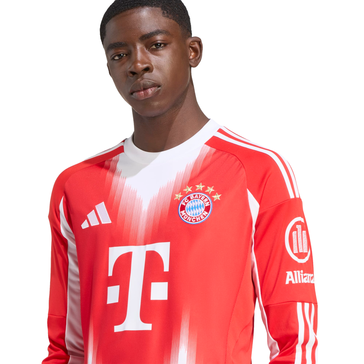 A young Black man wearing a red and white long-sleeved FC Bayern Munich soccer jersey with visible Adidas and T-Mobile logos against a white background.