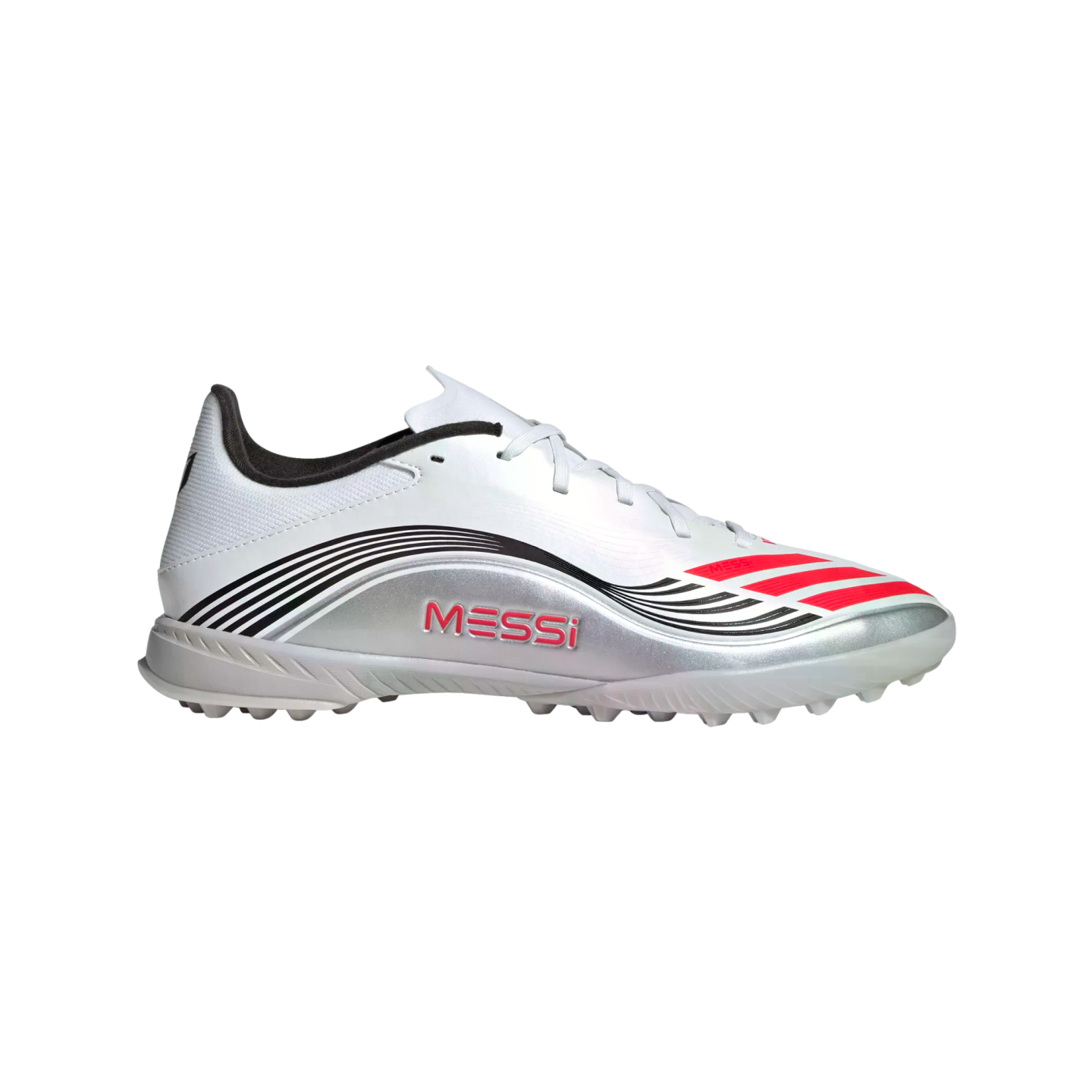 Side-profile shot of a white, silver, and red Adidas Messi turf soccer shoe with "MESSI" printed in red on its silver side. It features black and red stripe details.