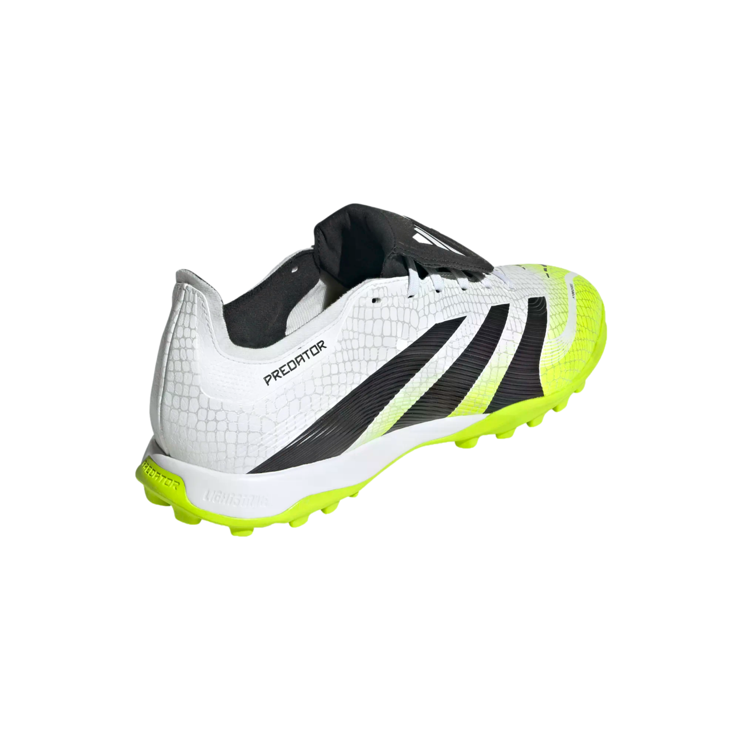 A white and neon yellow Adidas Predator turf soccer shoe with black stripes, a textured upper, and a fold-over tongue, shown from a rear three-quarter angle against a black background.